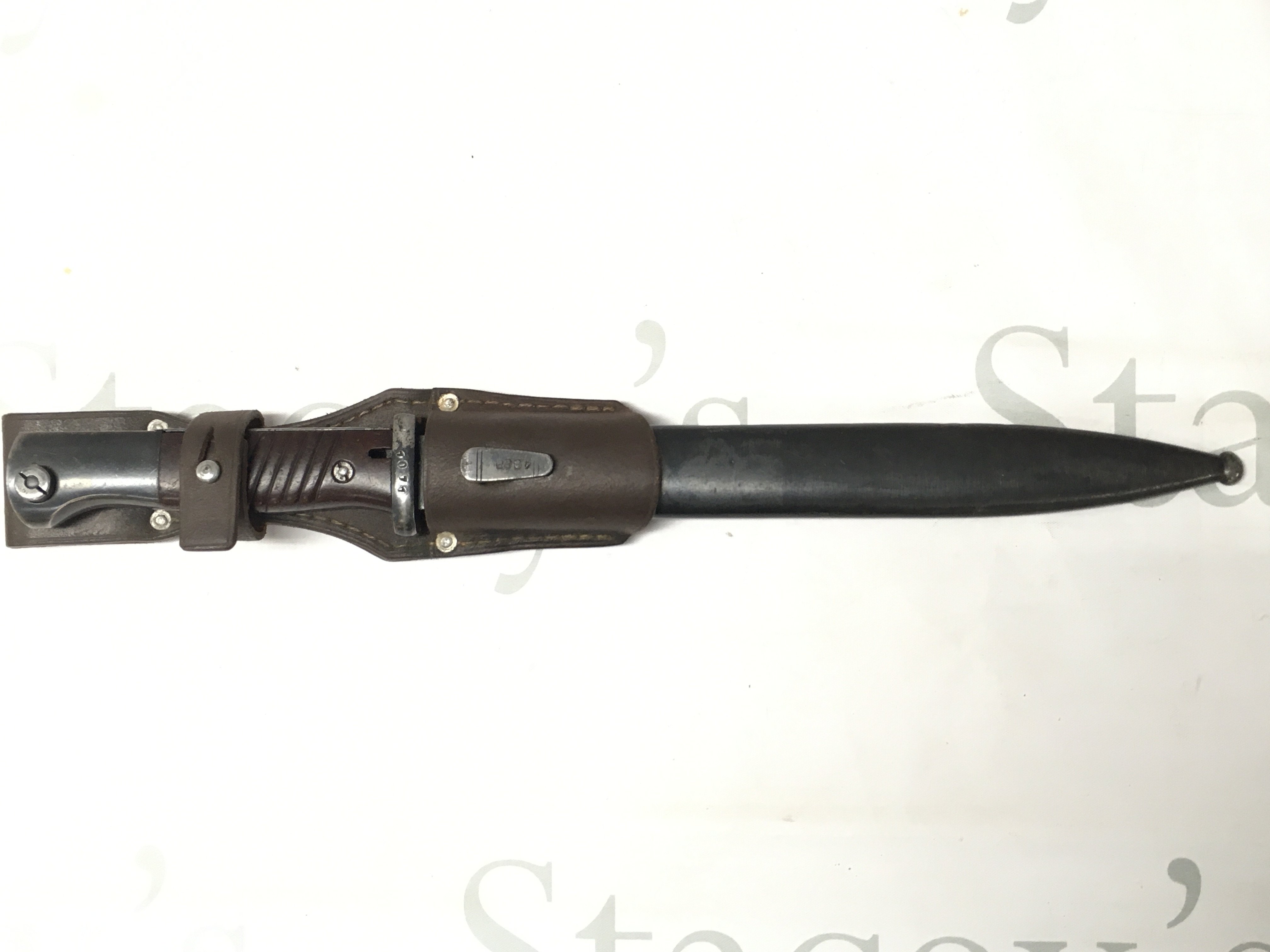 A WW2 German K98 bayonet with scabbard and frog. Frog marked Carl Ackva Bad Kreuznach 1939. blade 27.5cm long 41cm long total length.
