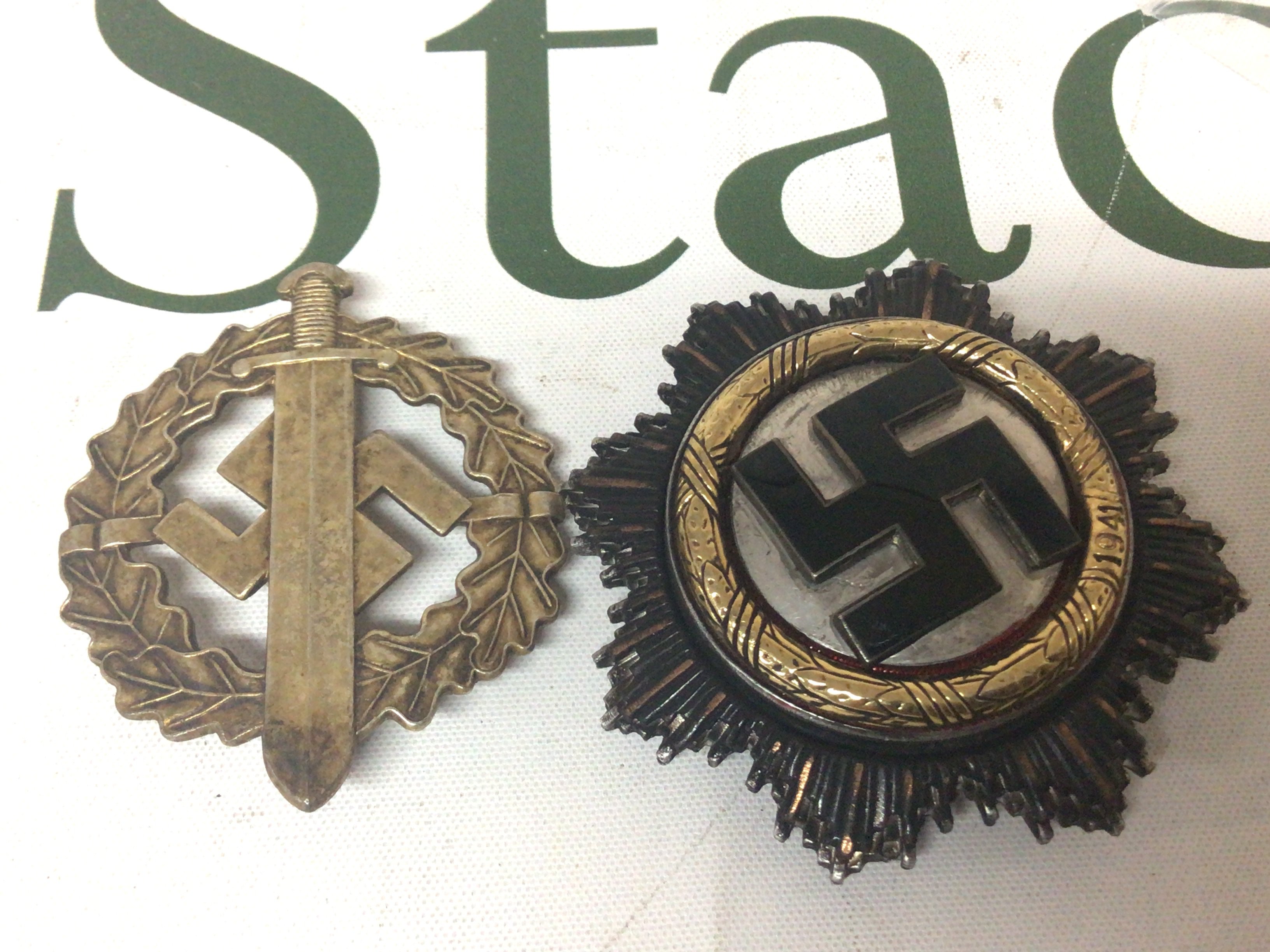 Original German Third Reich Sports badge the reverse with makers marks and a German badge given to high standing members of the German Third Reich political party. The reverse unmarked buyers must satisfy themselves possible retrospective copy. (2)