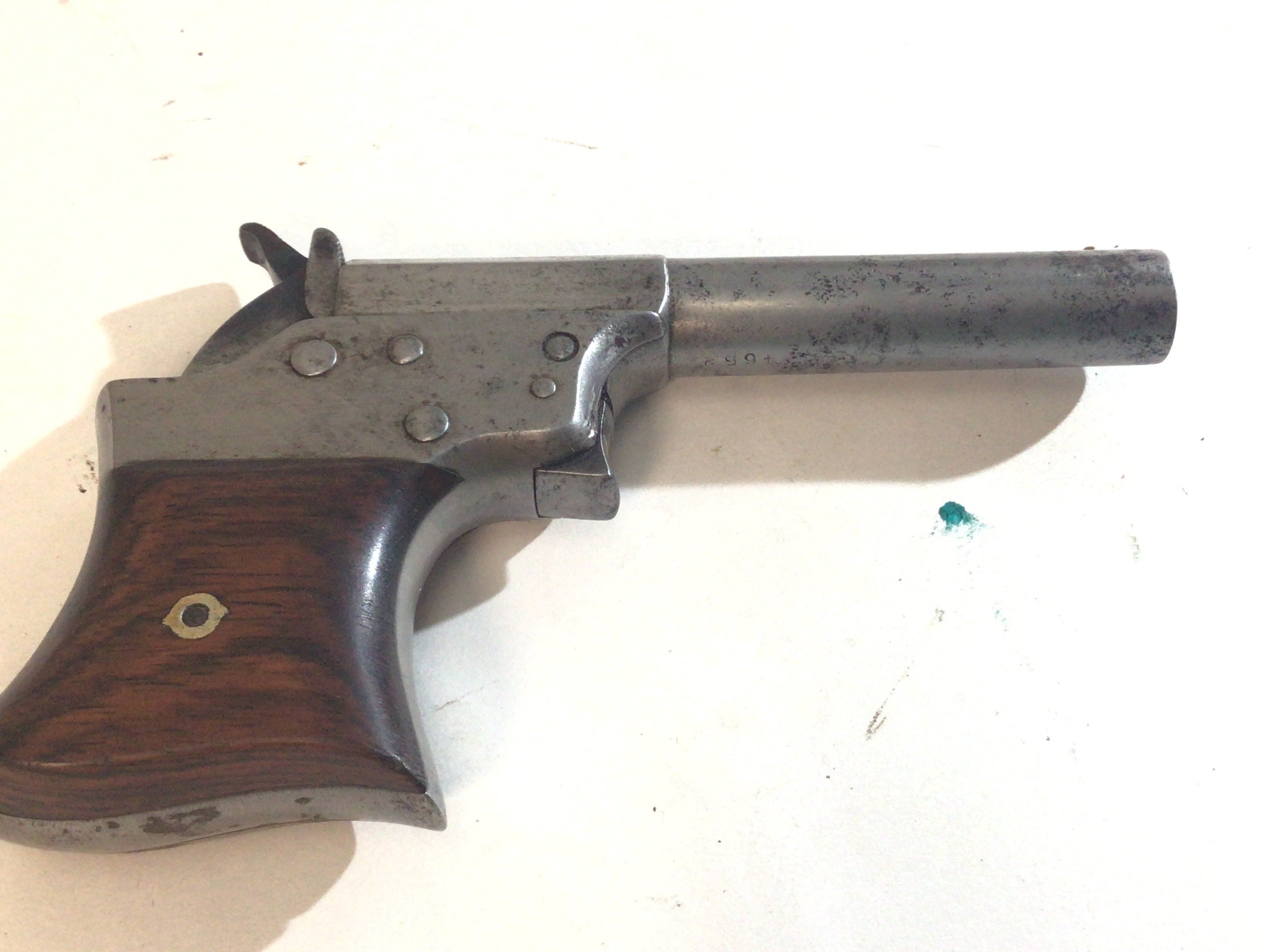 A Rare American Remington .41 Caliber Rim Fire Vest Pocket Deringer Pistol. Circa 1860 these where produced in low numbers the top of the action with Remington and Patient dates Oct 1 1861 serial number possible 861