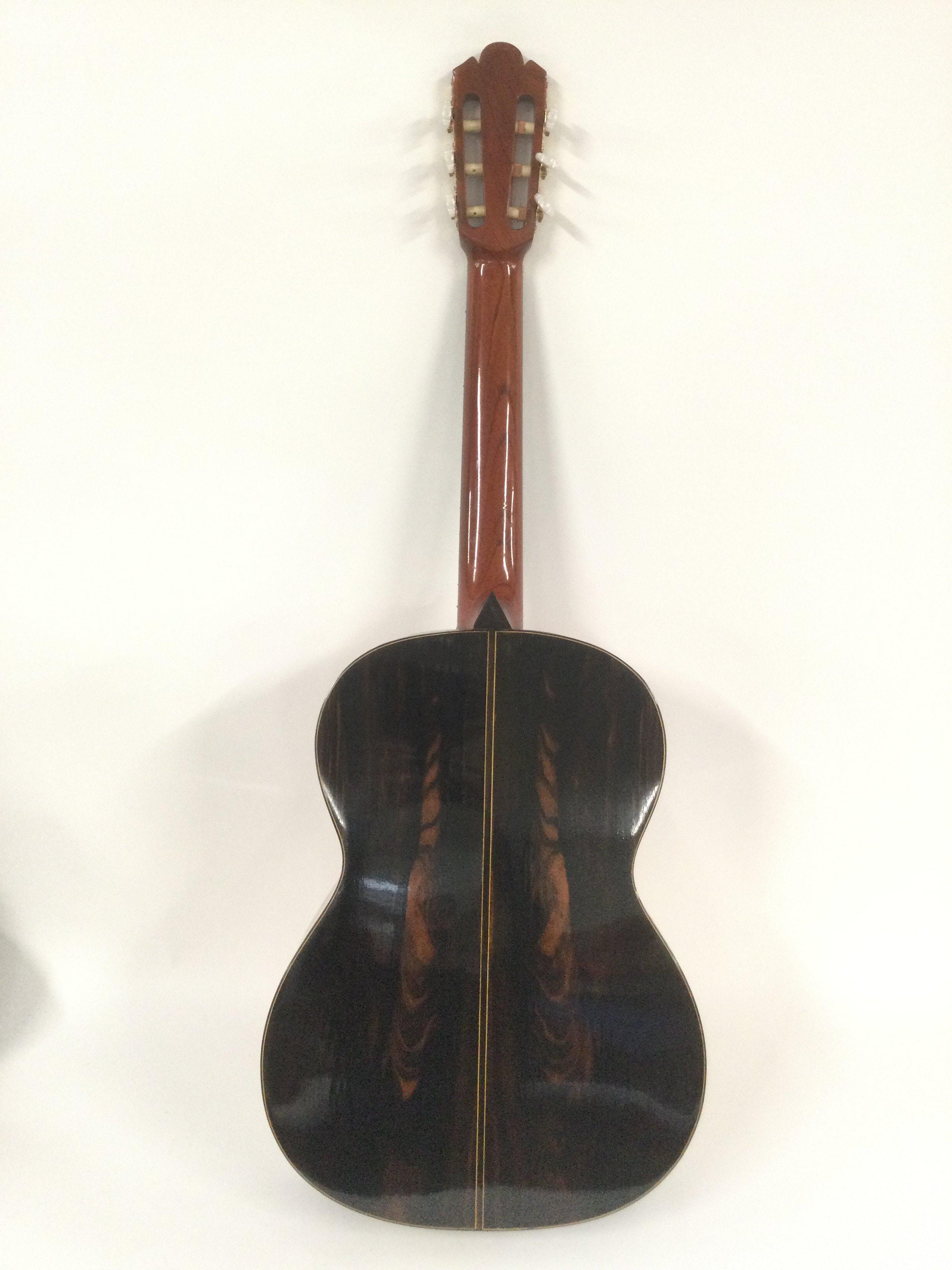 A hand built Susing's Guitar company classical guitar, model W35. Comes supplied with a hard carry case.