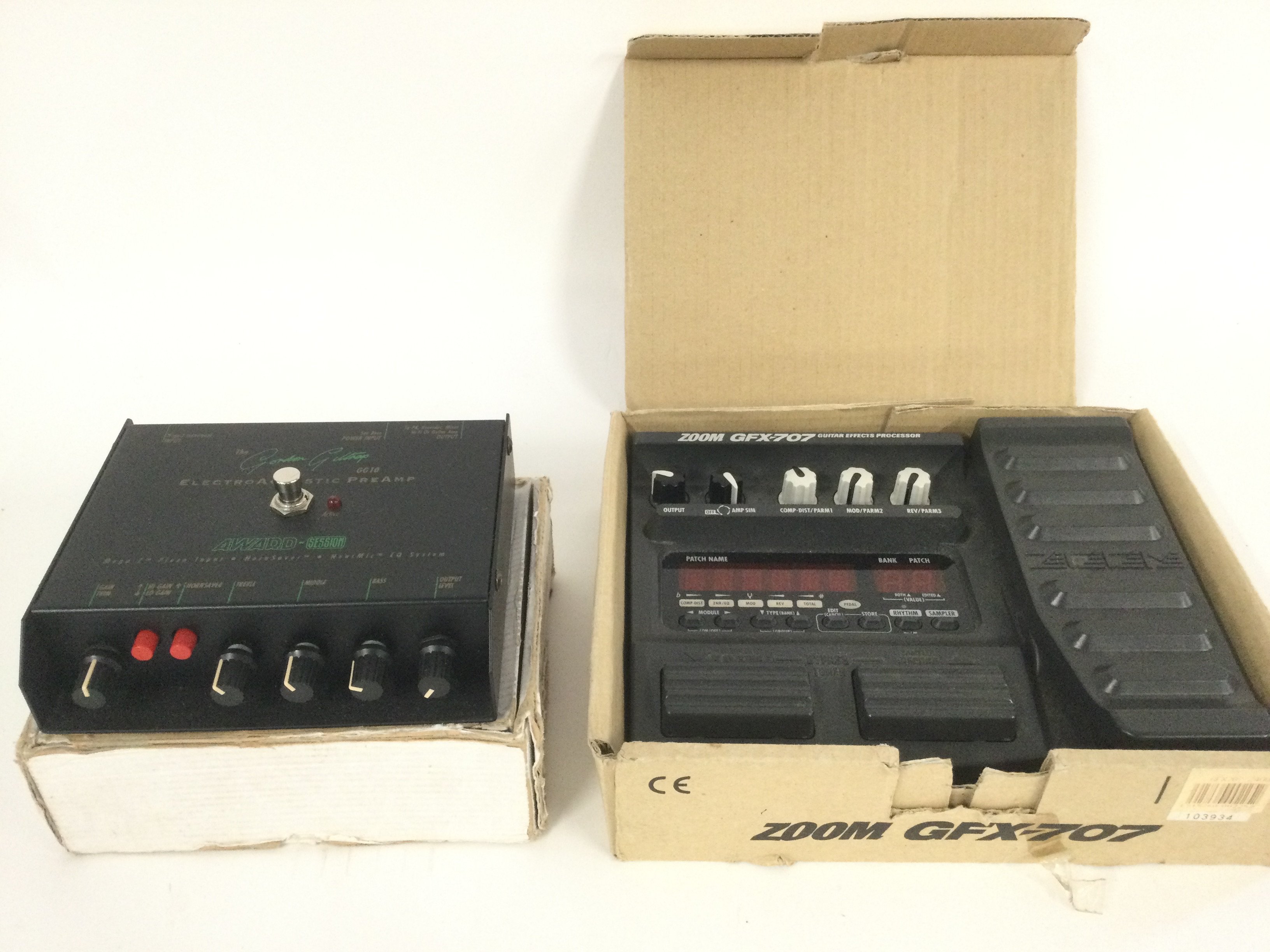 A boxed Zoom GFX-707 guitar effects processor and a Gordon Giltrap GG10 electro acoustic preamp (2).