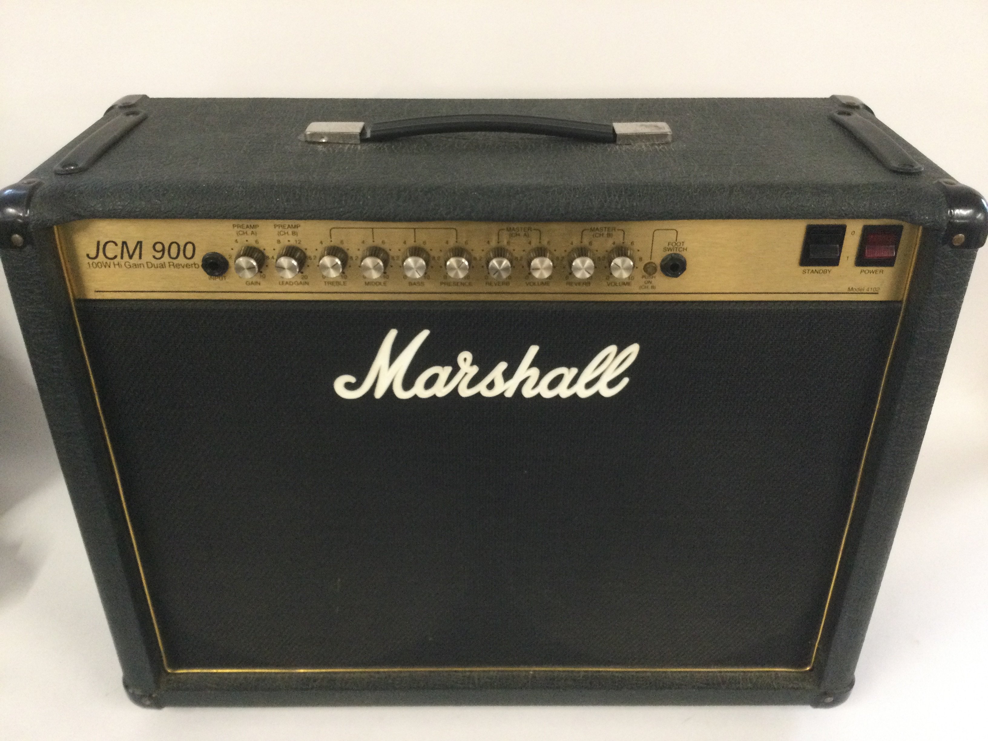 A Marshall 4102 JCM900 100W valve combo amplifier with footswitch, cover and spare Marshall potentiometers.