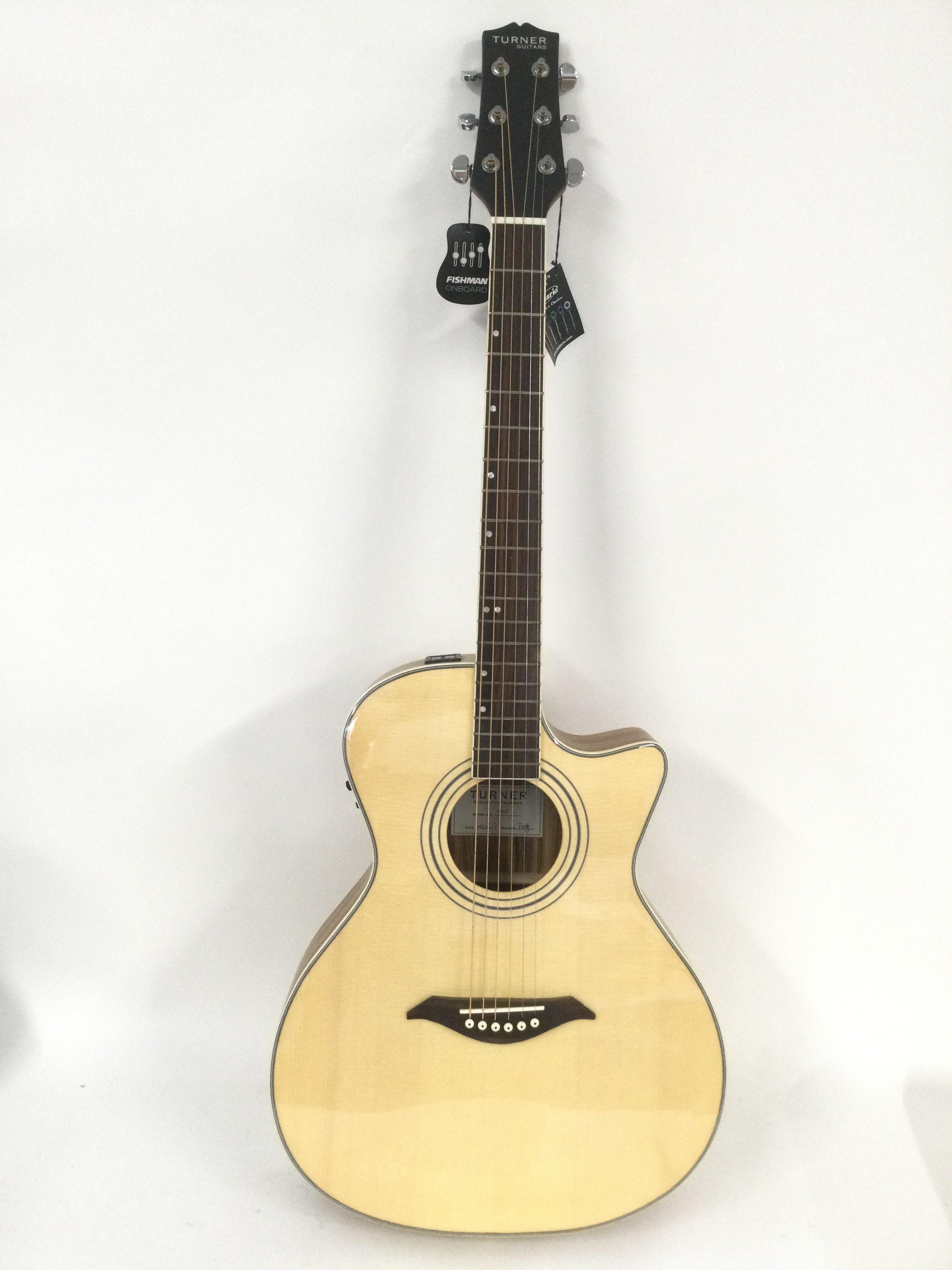 A brand new hand built Turner 42CE electro acoustic guitar with original retail box.