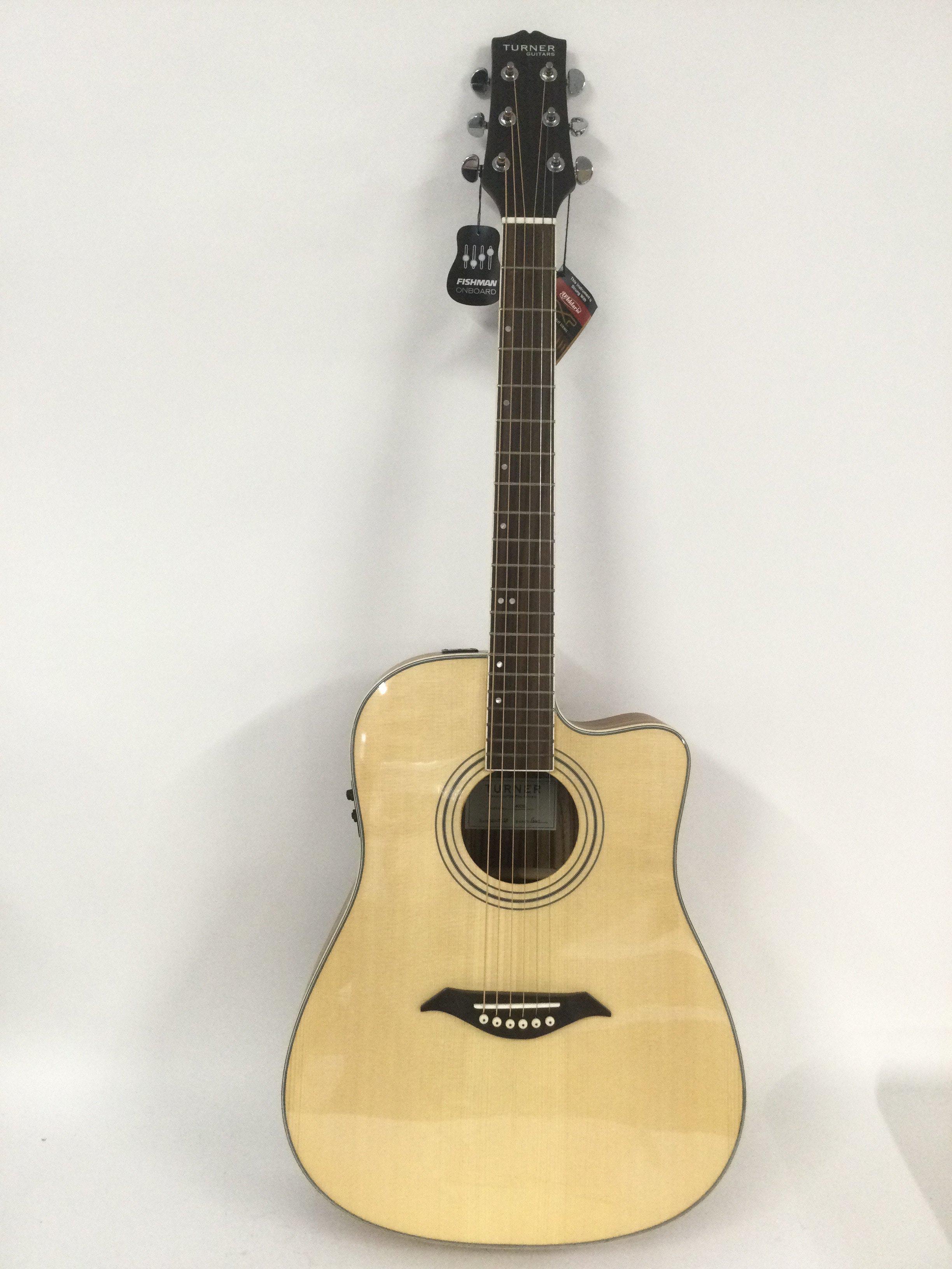 A brand new hand built Turner 40CE electro acoustic guitar with original retail box.