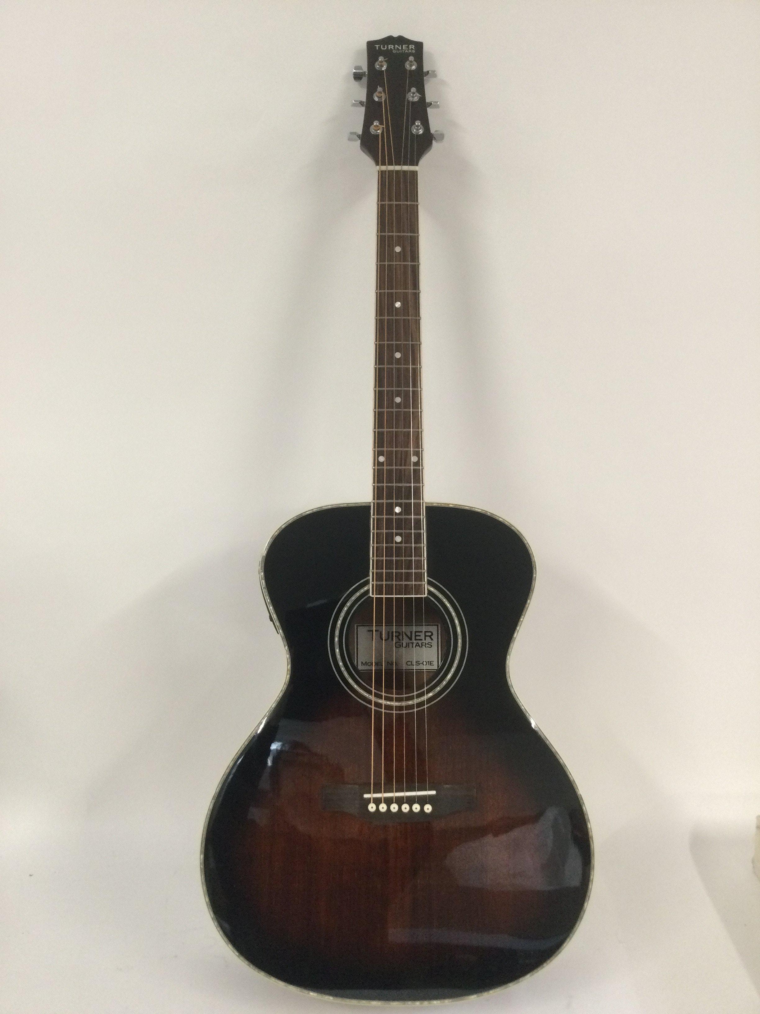 A brand new hand built Turner CLS-O1E electro acoustic guitar with original retail box.