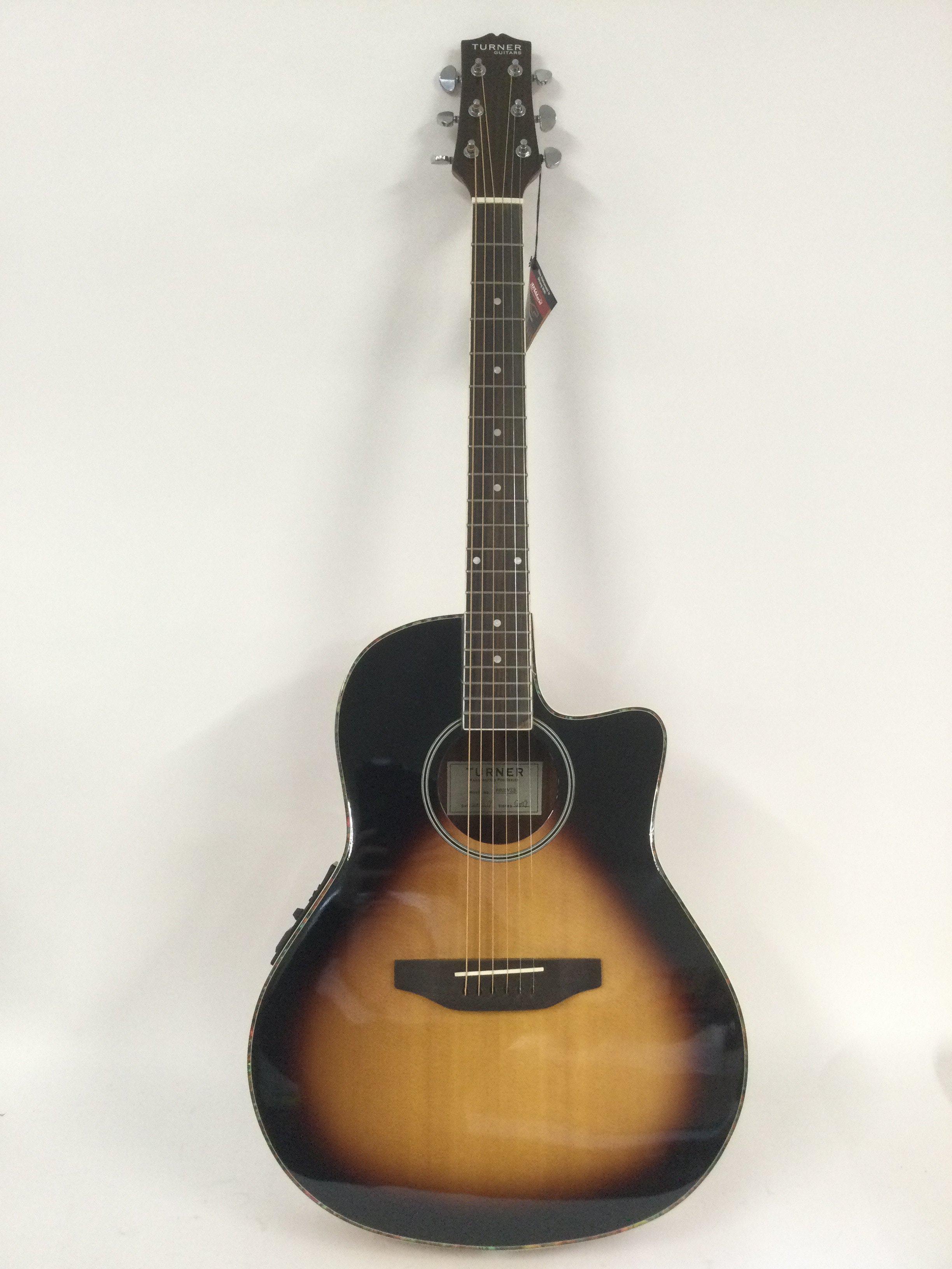 A brand new hand built Turner RB20VSB electro acoustic guitar with original retail box.