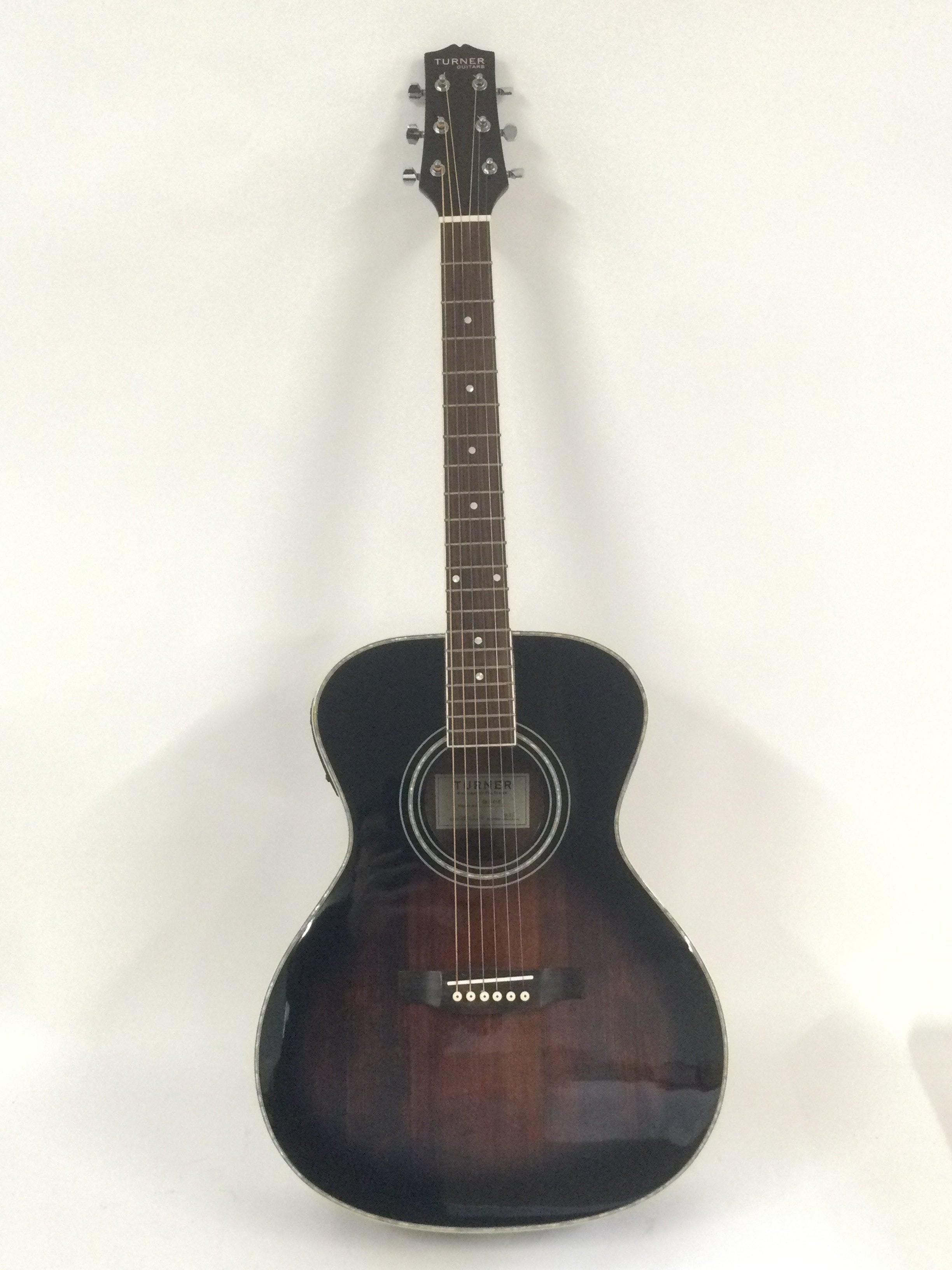 A brand new hand built Turner CLS-01E electro acoustic guitar with original retail box.