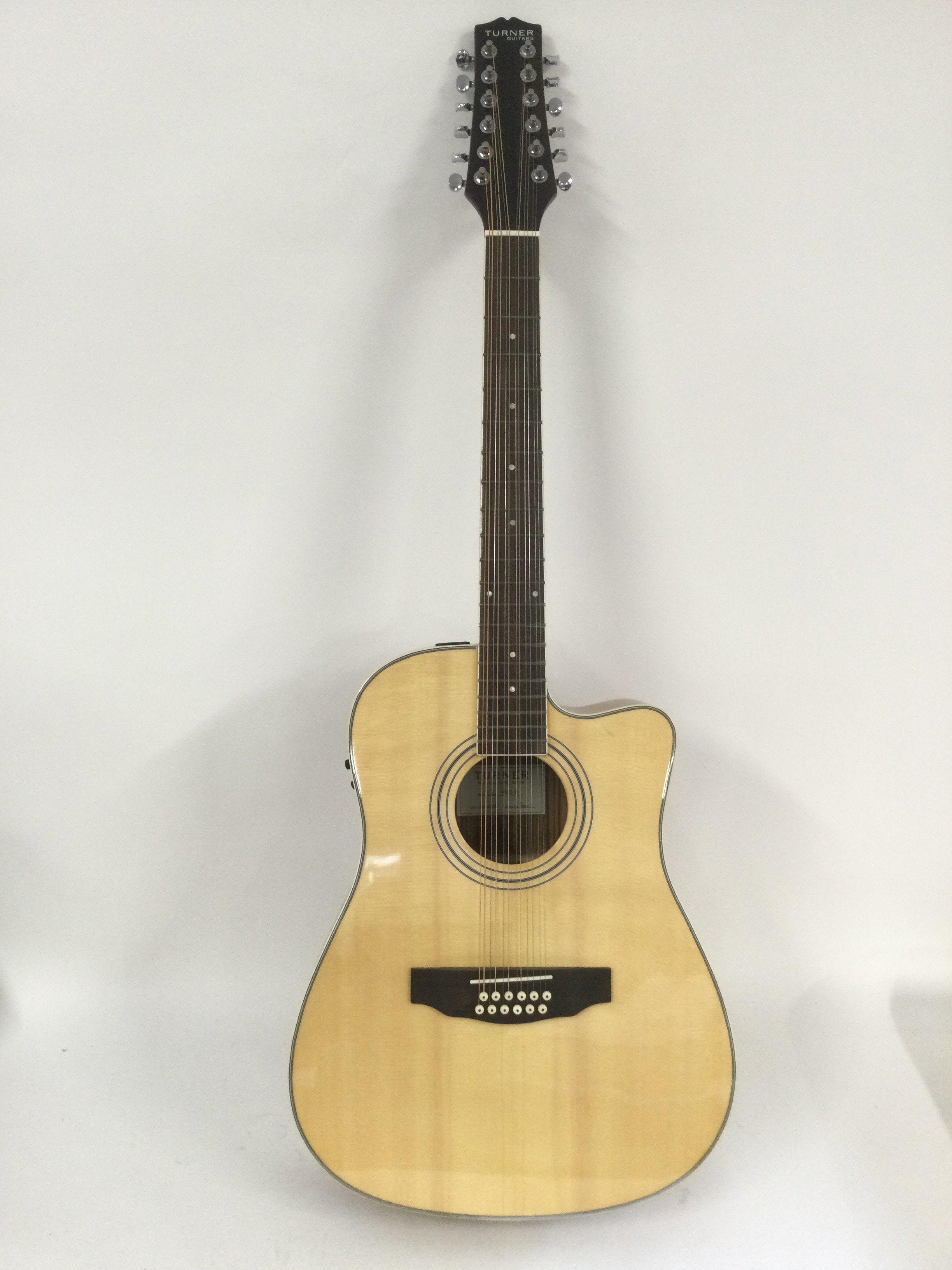 A brand new hand built Turner 40CE-12 12 string electro acoustic guitar with original retail box.