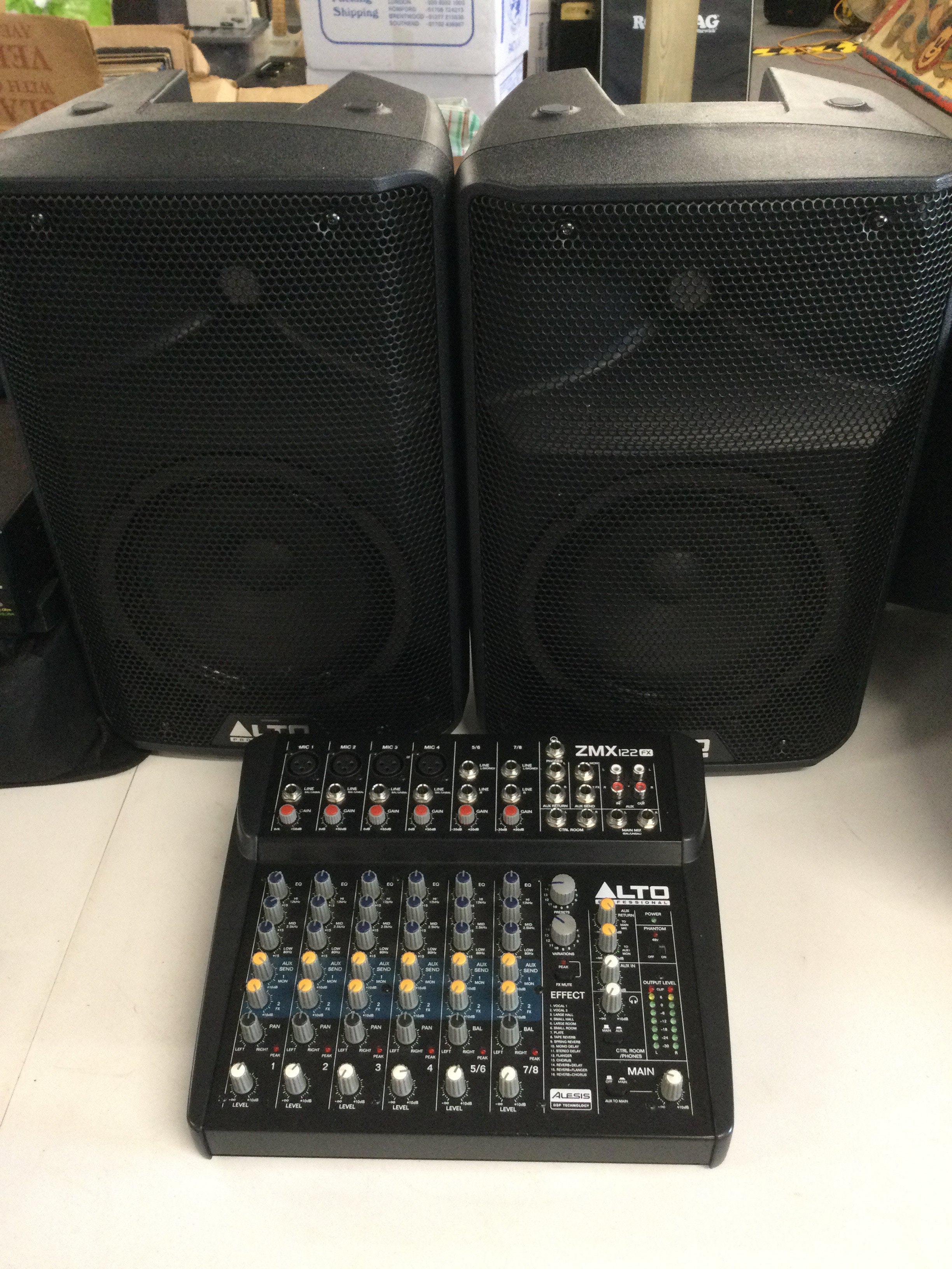 An Alto ZMX 122 FX mixer and a pair of Alto TX208 loudspeakers (3).