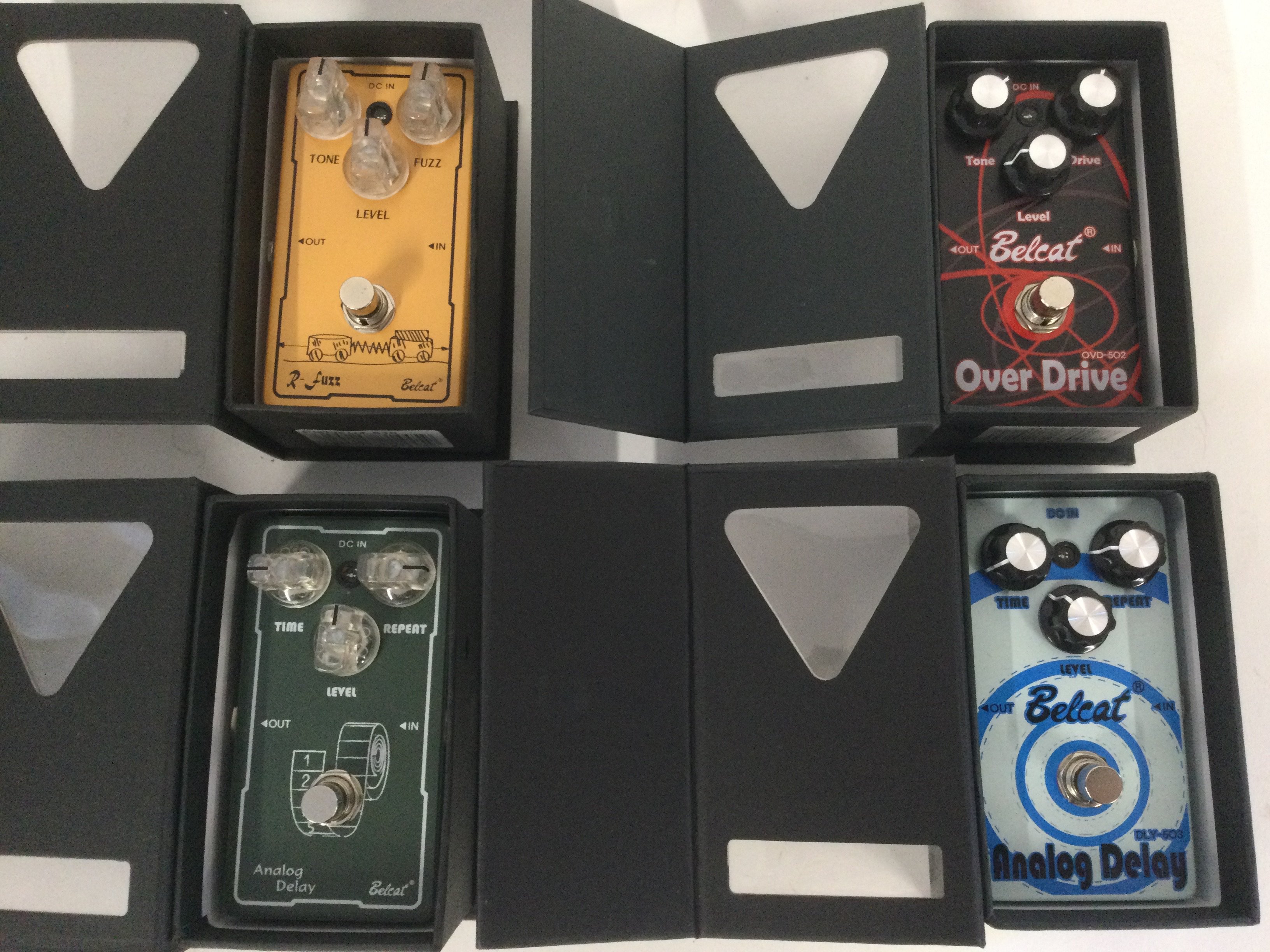 Four Belcat guitar effects pedals.