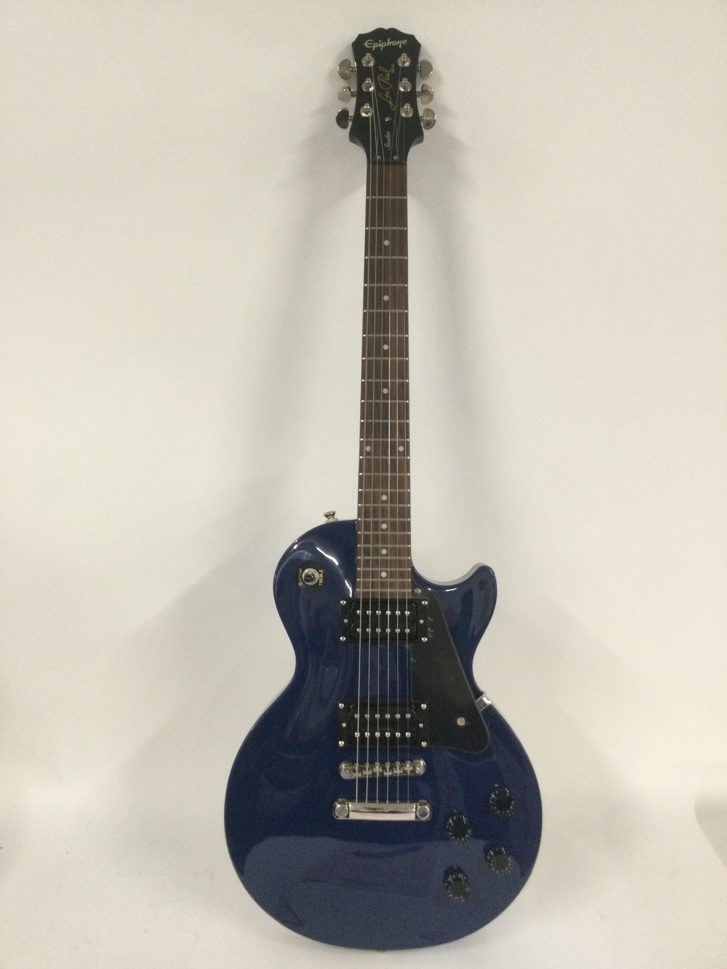 An as new condition Epiphone Les Paul Studio electric guitar in Blue. Twin Humbuckers and rosewood board with chrome parts and brightwork. As new condition unplayed with plastic still on the pick guard. Comes with original Epiphone branded hard carry case.