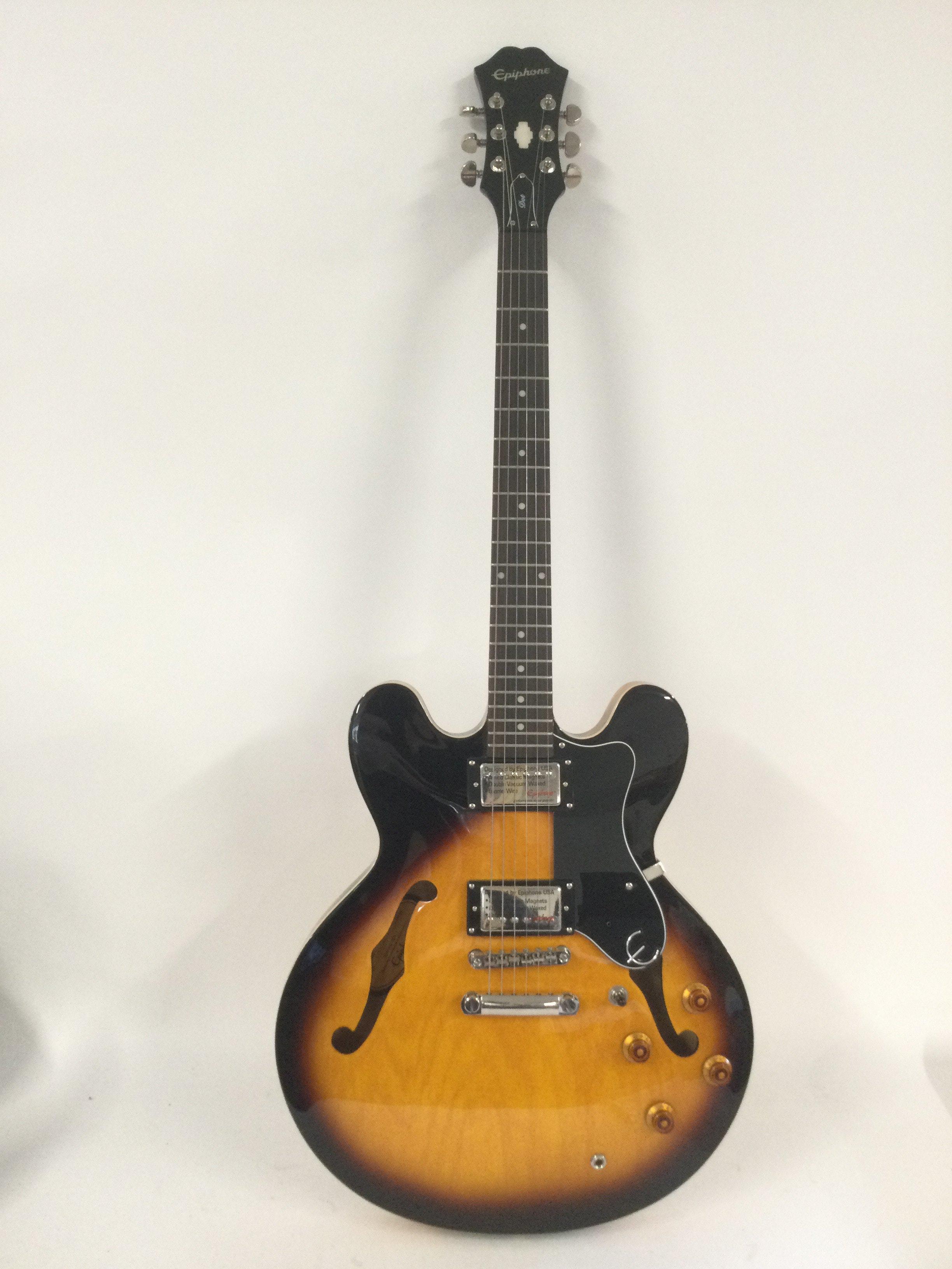 An Epiphone Dot electric guitar. Still has retail stickers attached. Comes with original retail box.