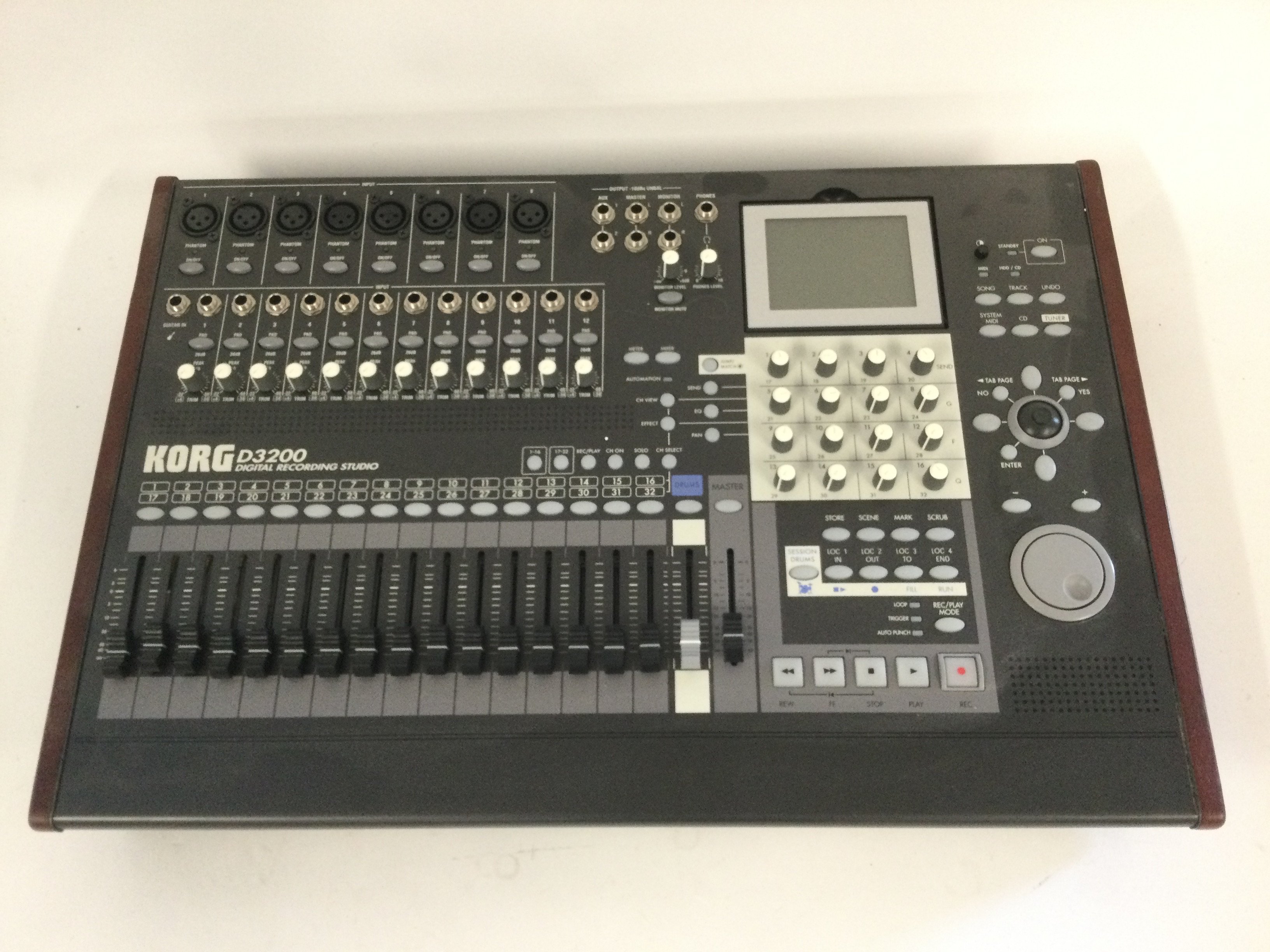 A boxed Korg D3200 digital recording studio.