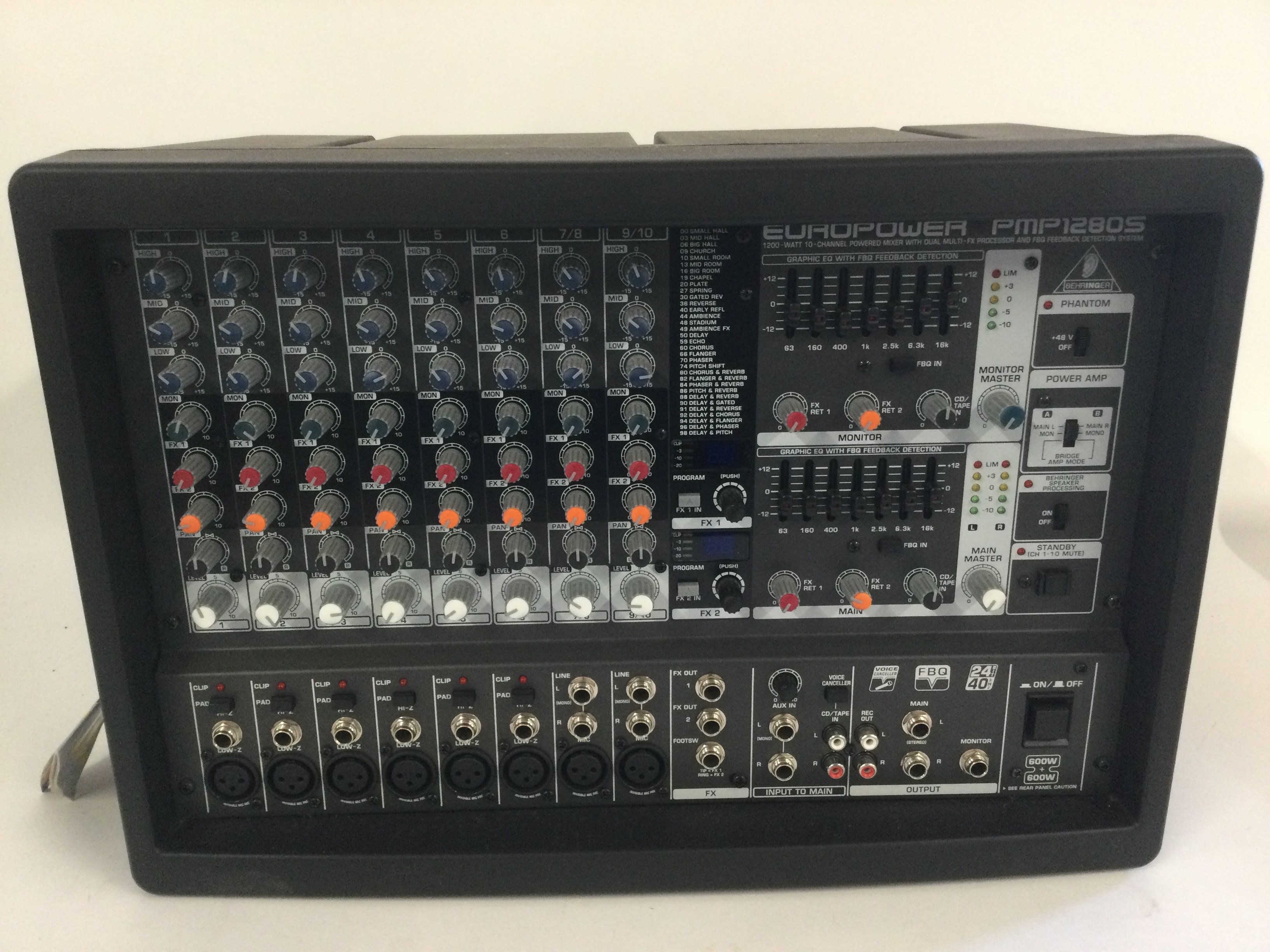 A boxed Behringer PMP-1280S 1,200W powered mixer with dual multi fx processor.