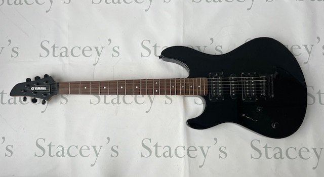 A Yamaha RGX 121 left handed electric guitar in black with black chrome parts. Good overall condition with some playwear and marks to back. No case.