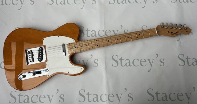 Squier Telecaster solid body electric guitar - made in China Natural finish with chrome parts. In good to very good condition. Very little evidence of any playwear. No marks, damage or fretwear.