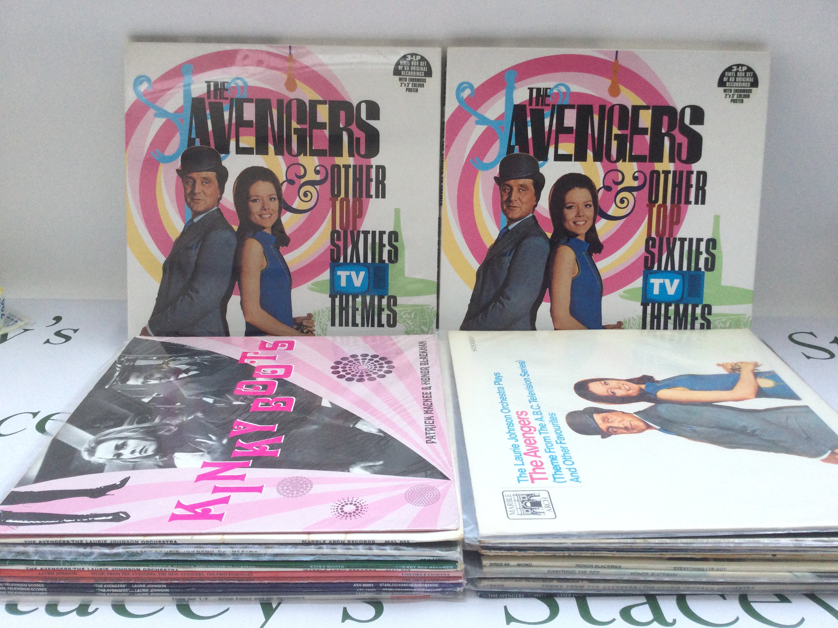 A collection of The Avengers and other TV theme related LPs and 7" singles including some demonstration discs plus a laser disc of The Avengers.