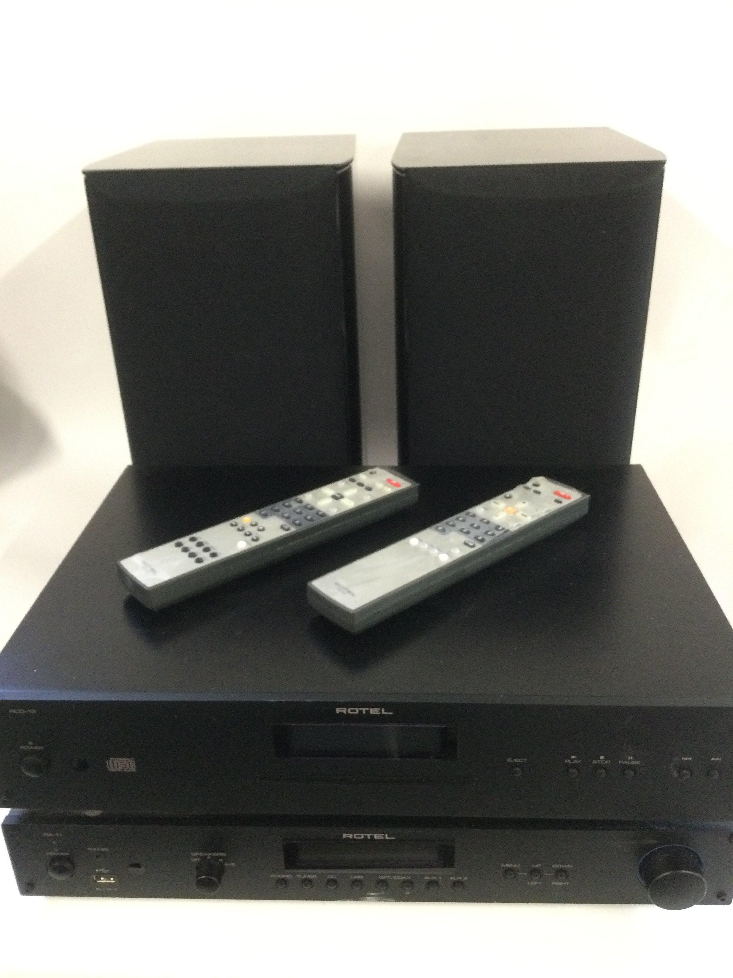 A Rotel RA-11 Amplifier, Rotel RCD-12 CD player and a pair of Focal Aria 906 bookshelf speakers. Comes with two remote controls and leads.