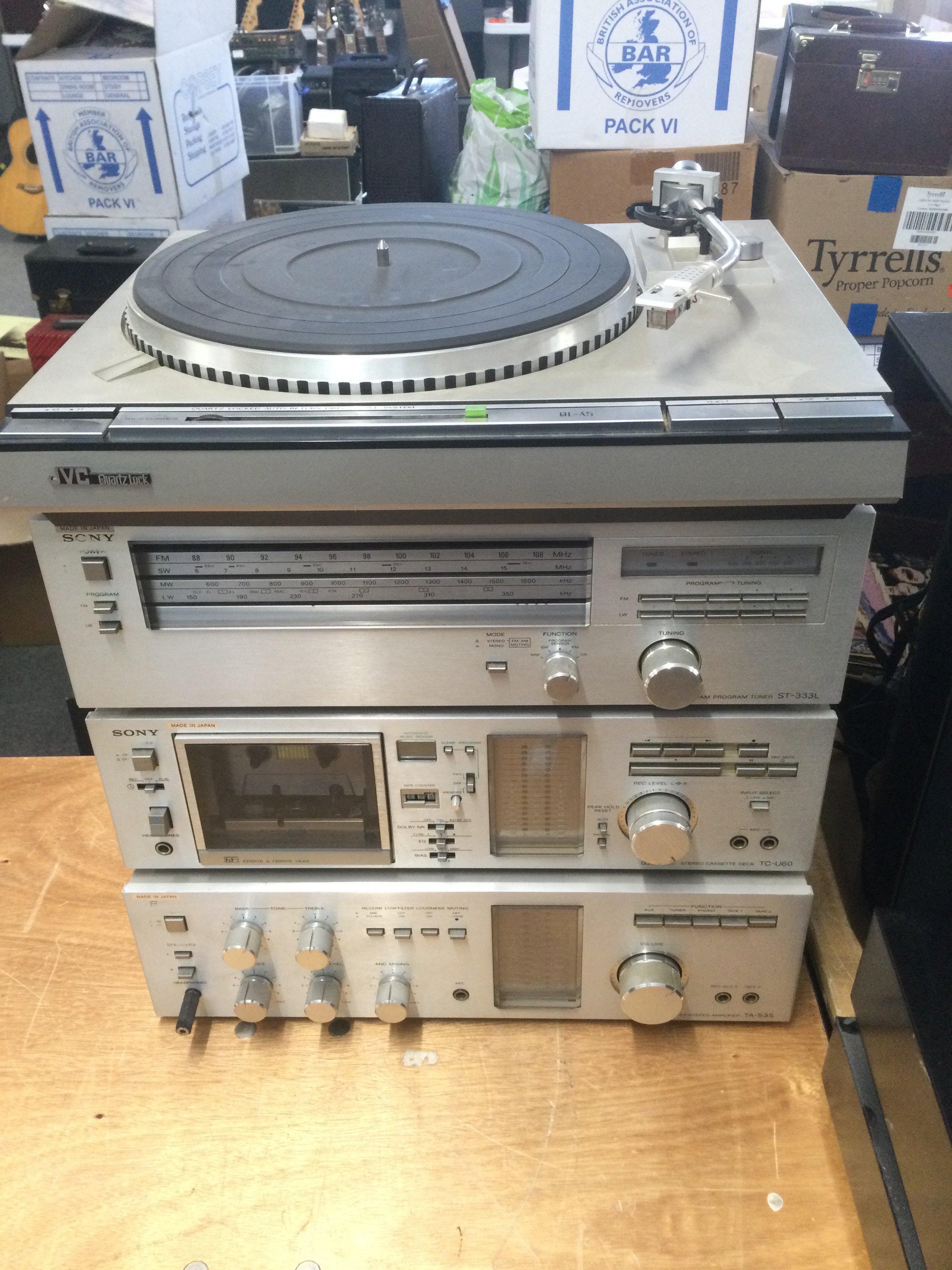 A JVC QL-A5 record player and three Sony hi-fi separates comprising an ST-333L Tuner, TC-U60 cassette deck and TA-535 amplifier (4).