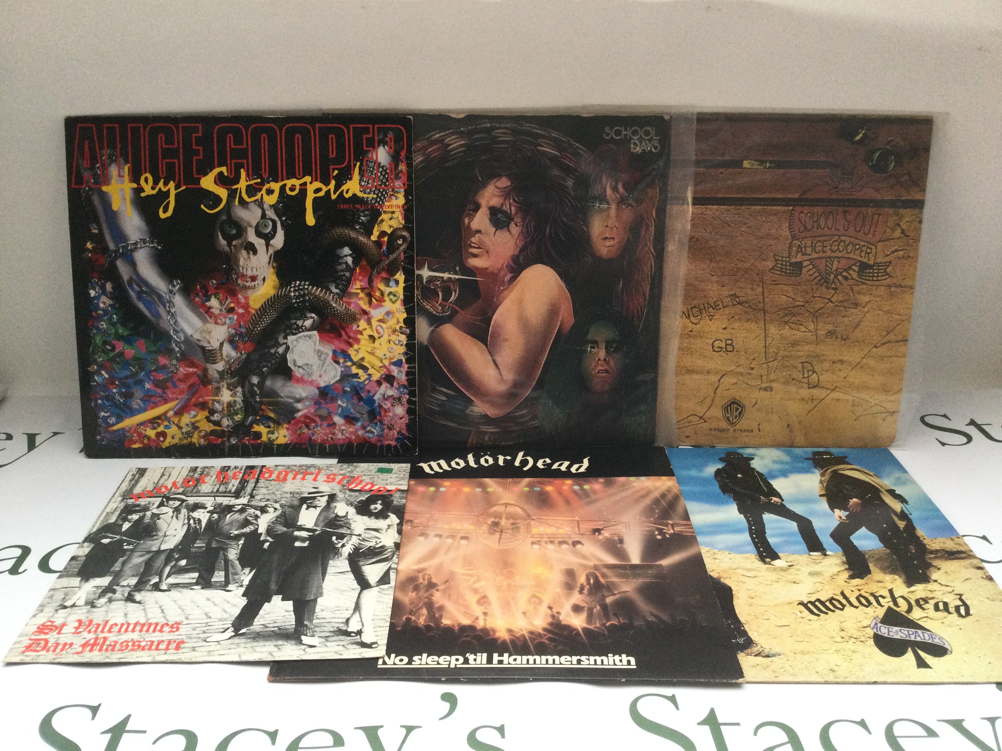 A collection of LPs and 12" singles by Alice Cooper, Motorhead and Judas Priest comprising 'School's Out', 'Ace Of Spades', 'Point Of Entry' and others.