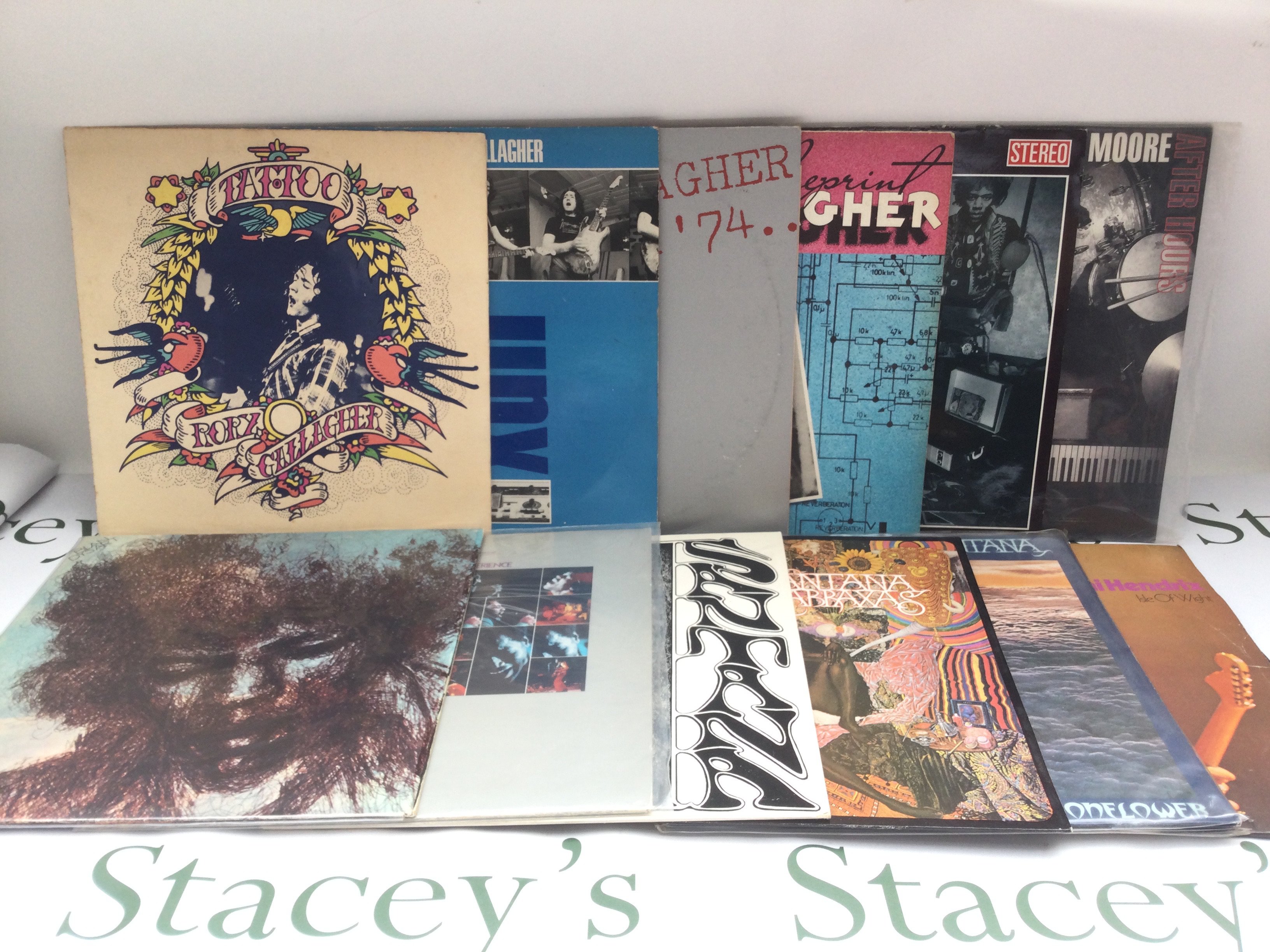 Twelve rock and blues LPs by various artists including Jimi Hendrix, Rory Gallagher, Gary Moore and Santana.