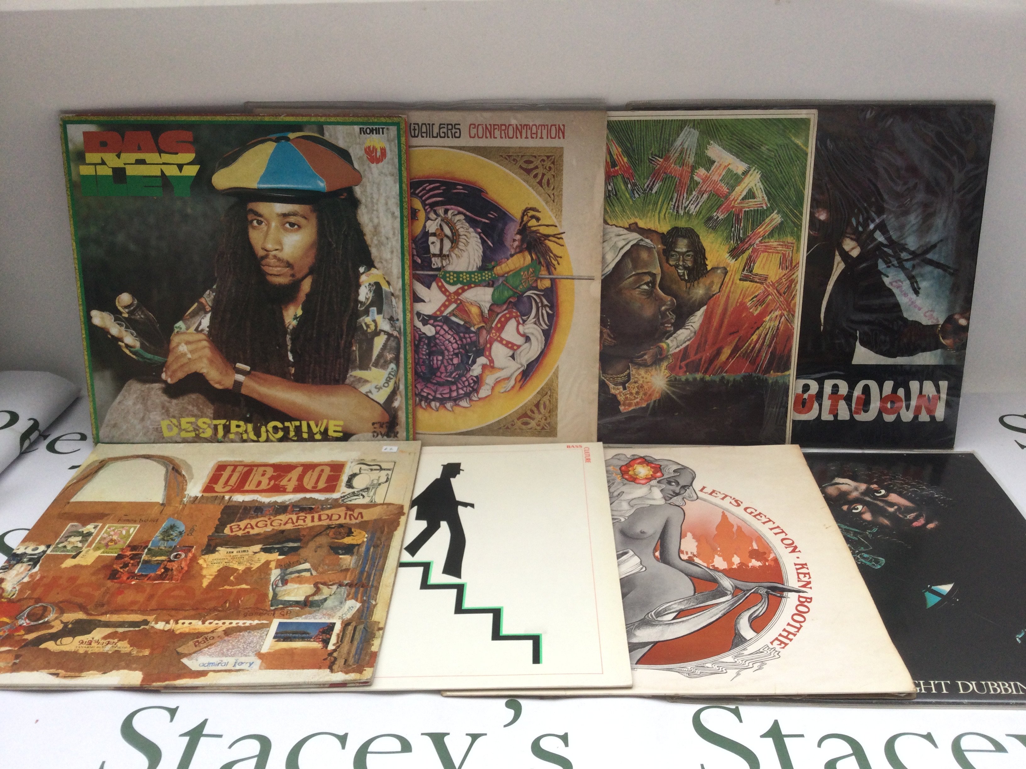 Two bags of over 30 reggae LPs and 12" singles by various artists including Bob Marley, Peter Tosh, Third World and others.