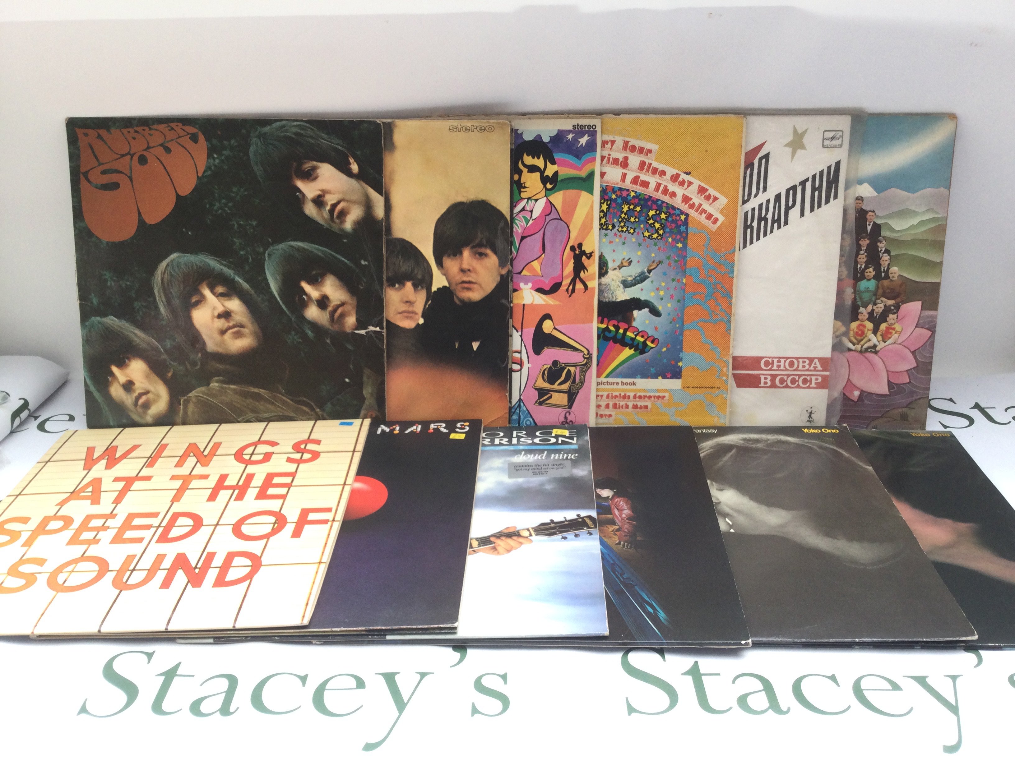 Twelve Beatles and solo LPs comprising 'Rubber Soul', a US Capitol pressing of 'Magical Mystery Tour', 'Dark Horse' and others.