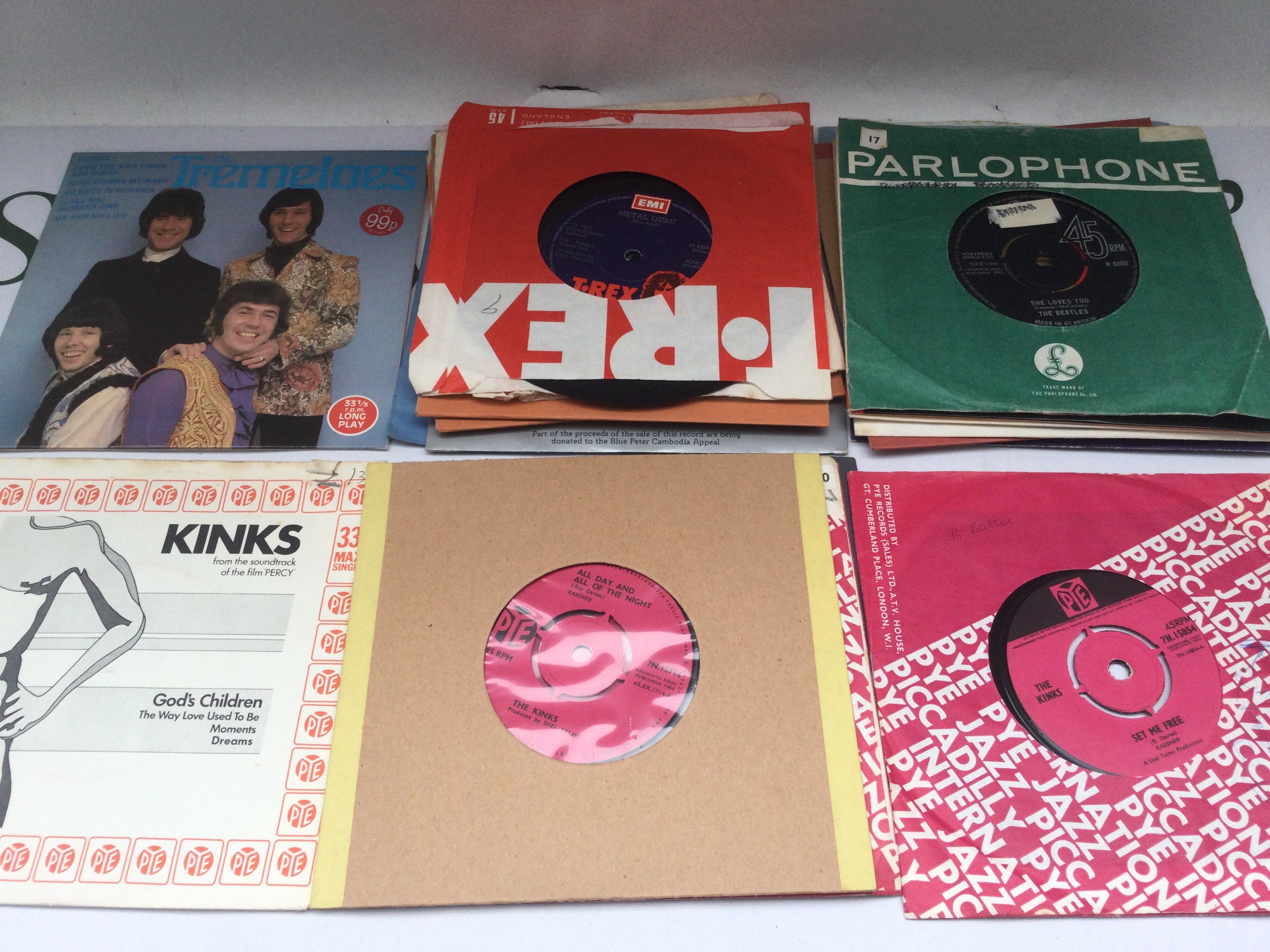 A small collection of 7" singles and EPs by various artists including The Beatles, The Kinks and others.