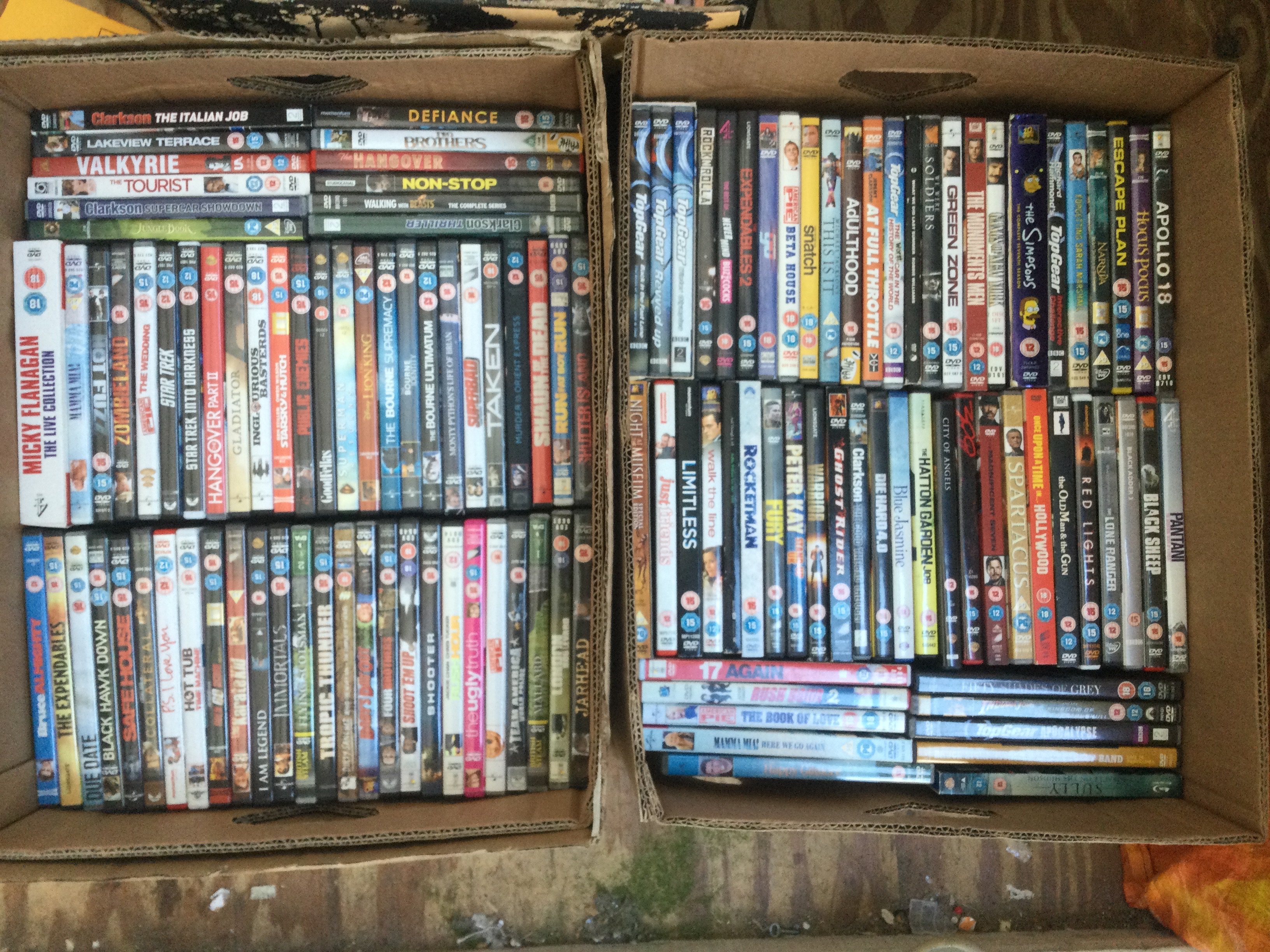 Two boxes of CDs and DVDs.