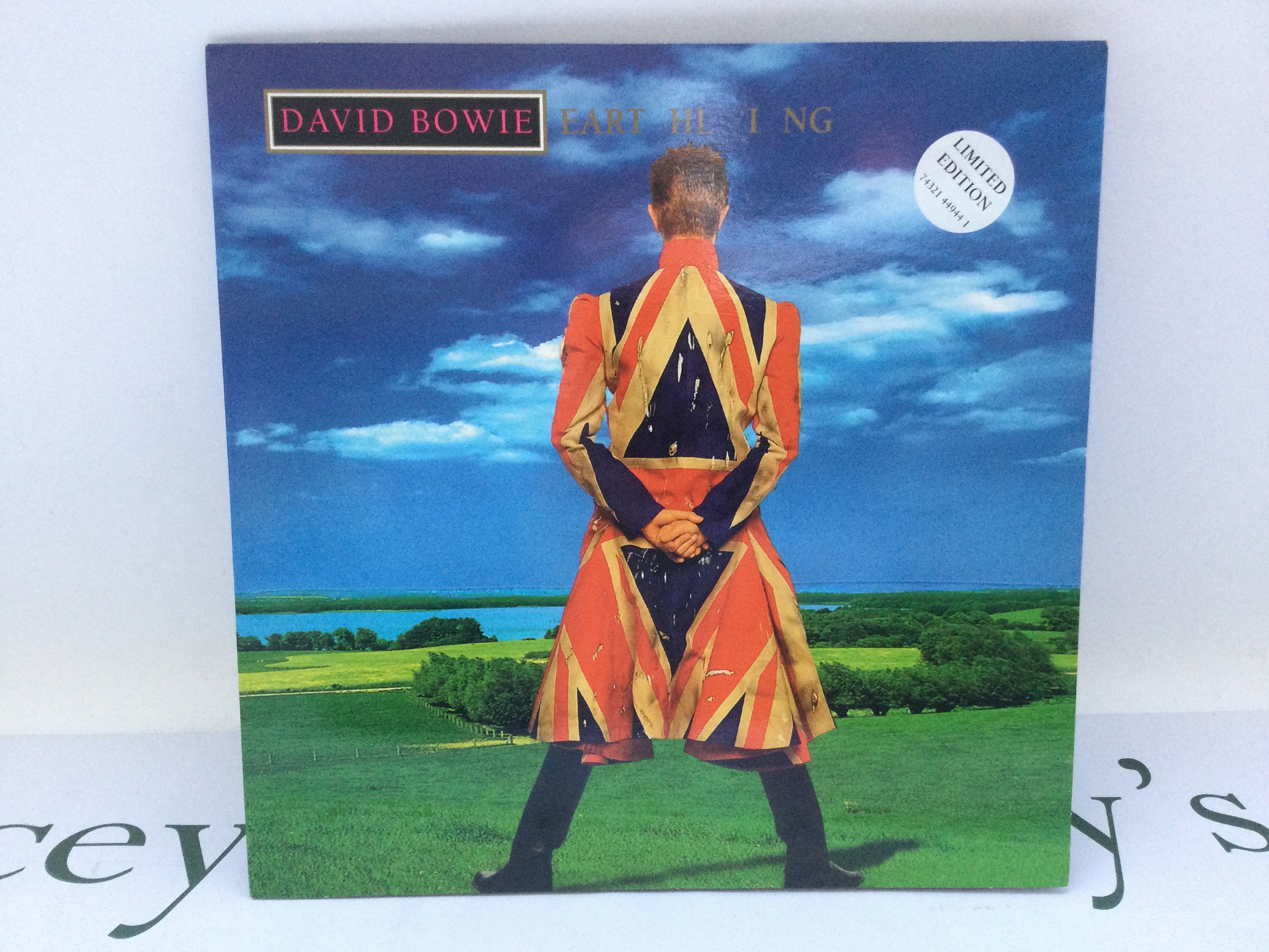 A limited edition first UK pressing of the David Bowie LP 'Earthling' housed in a gatefold sleeve, 74321 44944 1. Sleeve VG+, Vinyl Ex.