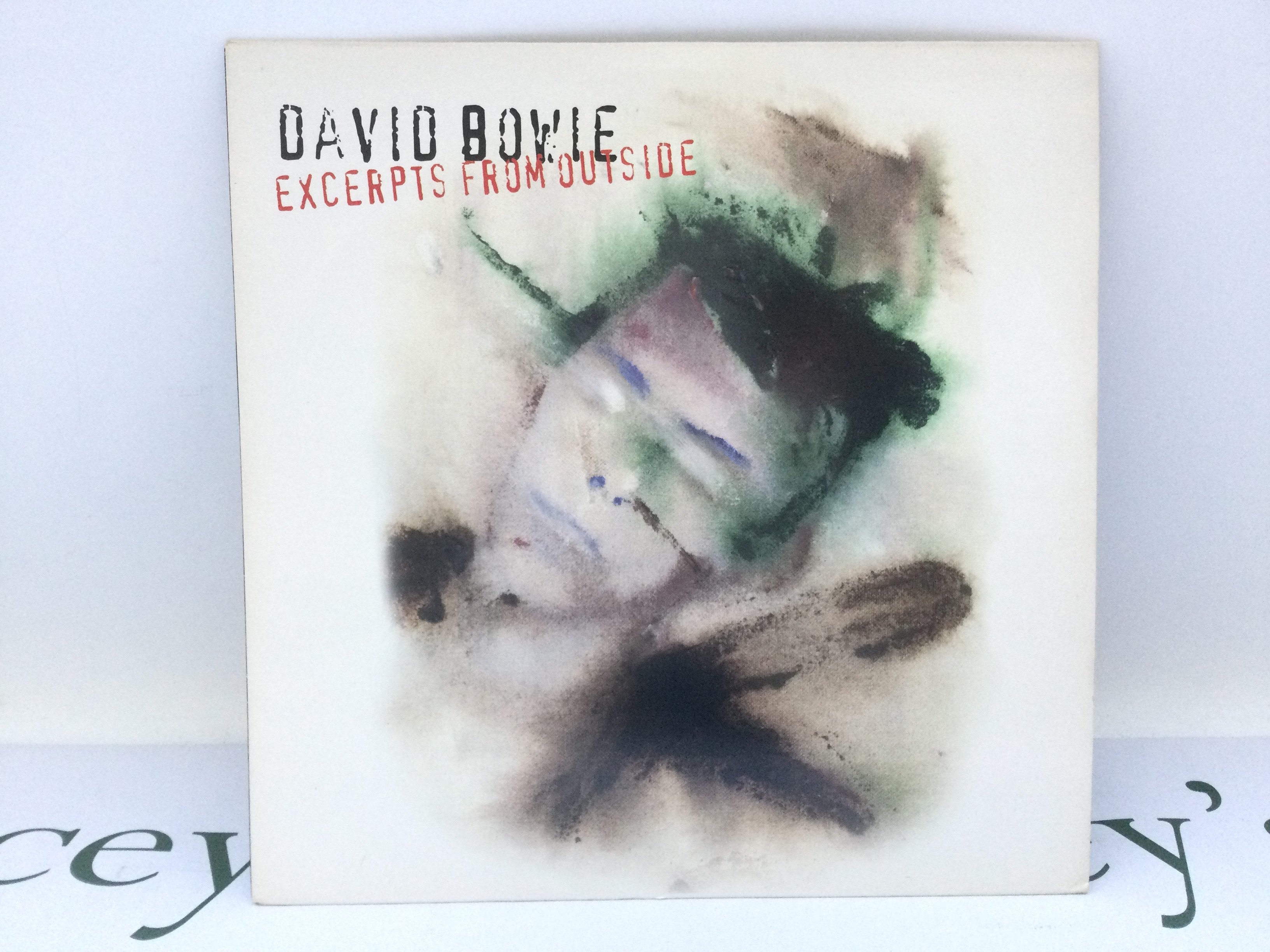 A first UK pressing of the David Bowie LP 'Excerpts From Outside', 74321307021. Sleeve VG+, Vinyl Ex.