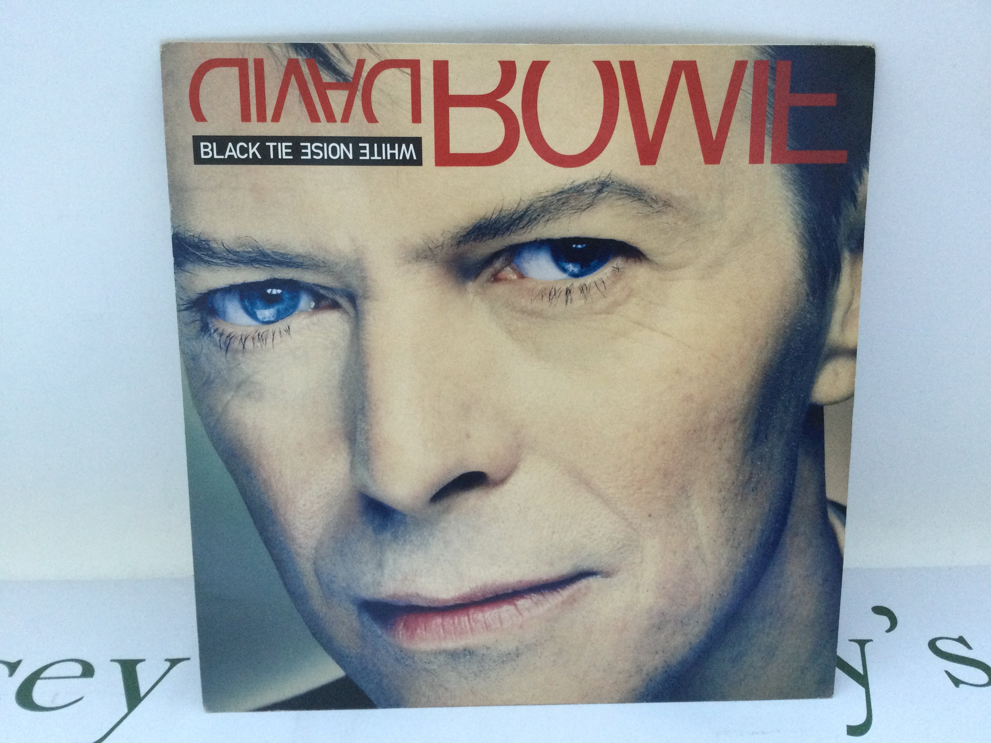 A first UK pressing of the David Bowie LP 'Black Tie White Noise', 74321 13697 1. Sleeve Ex, Vinyl Ex.