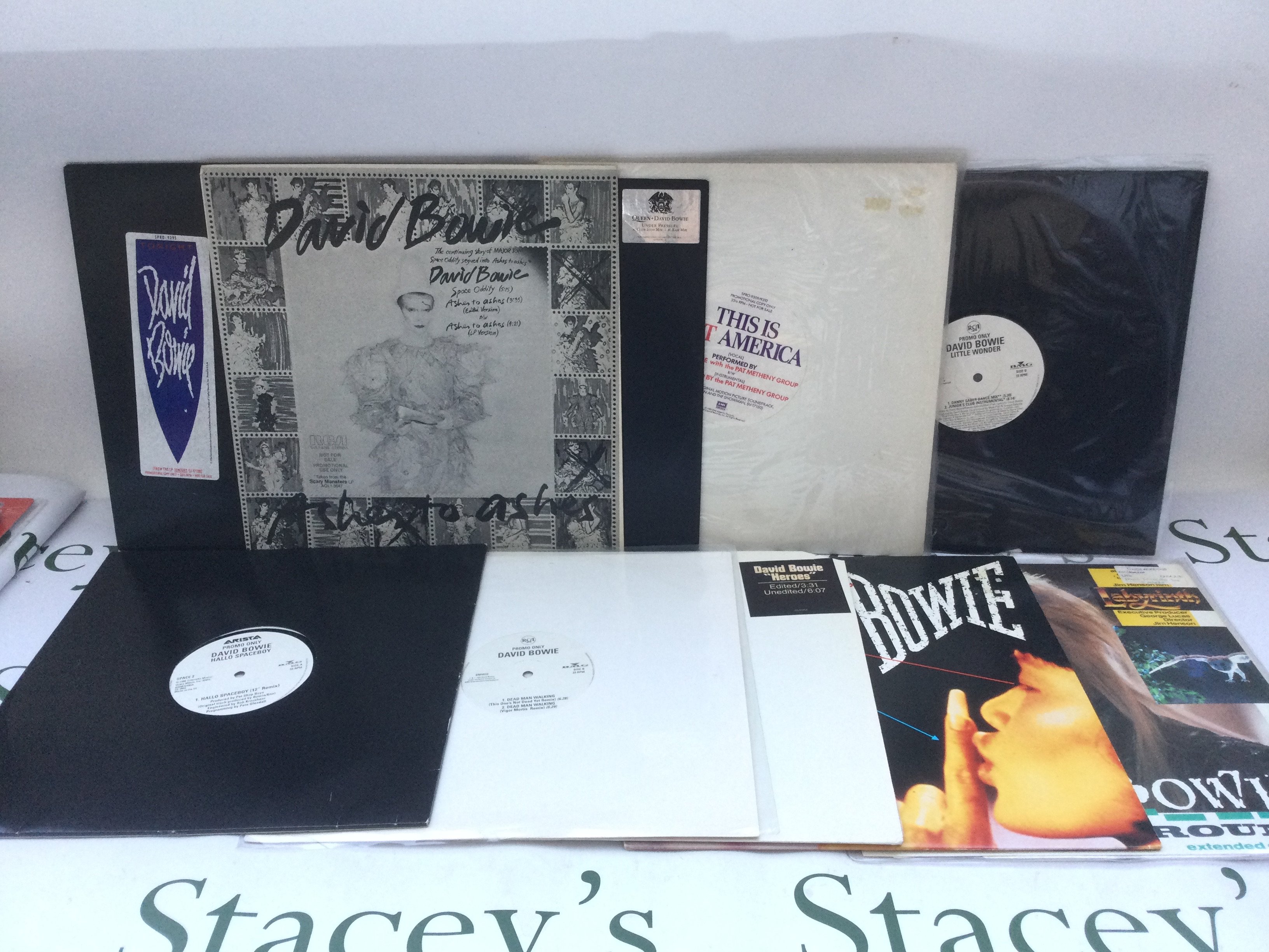 Two bags containing a collection of David Bowie promotional 12" singles including 'Heroes', 'China Girl', 'Under Pressure' and others.