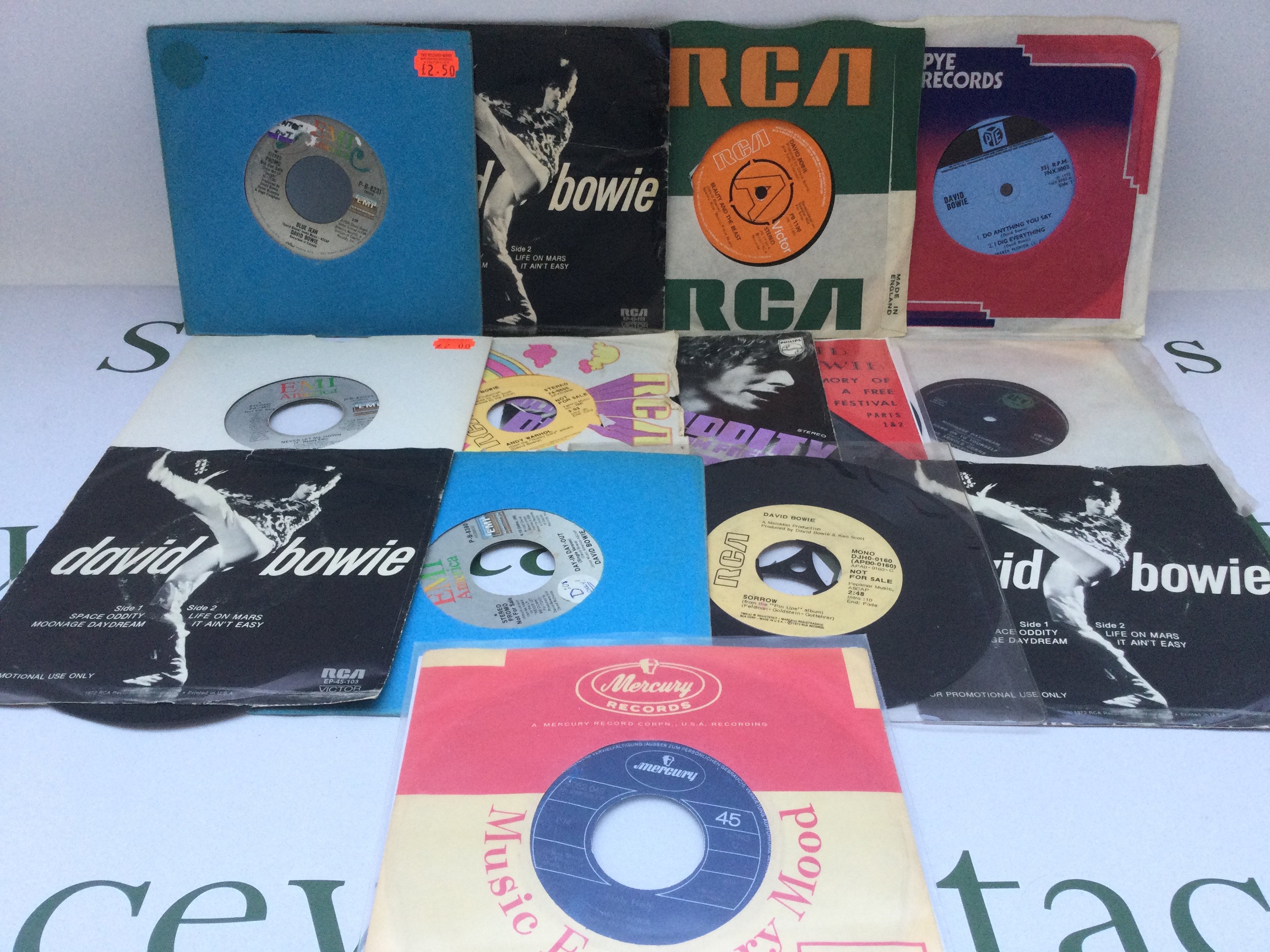 A collection of David Bowie 7" singles and EPs comprising a collectable 'Holy Holy' b/w 'Black Country Rock', a 1972 EP of early releases including 'I Dig Everything', various promo discs etc.