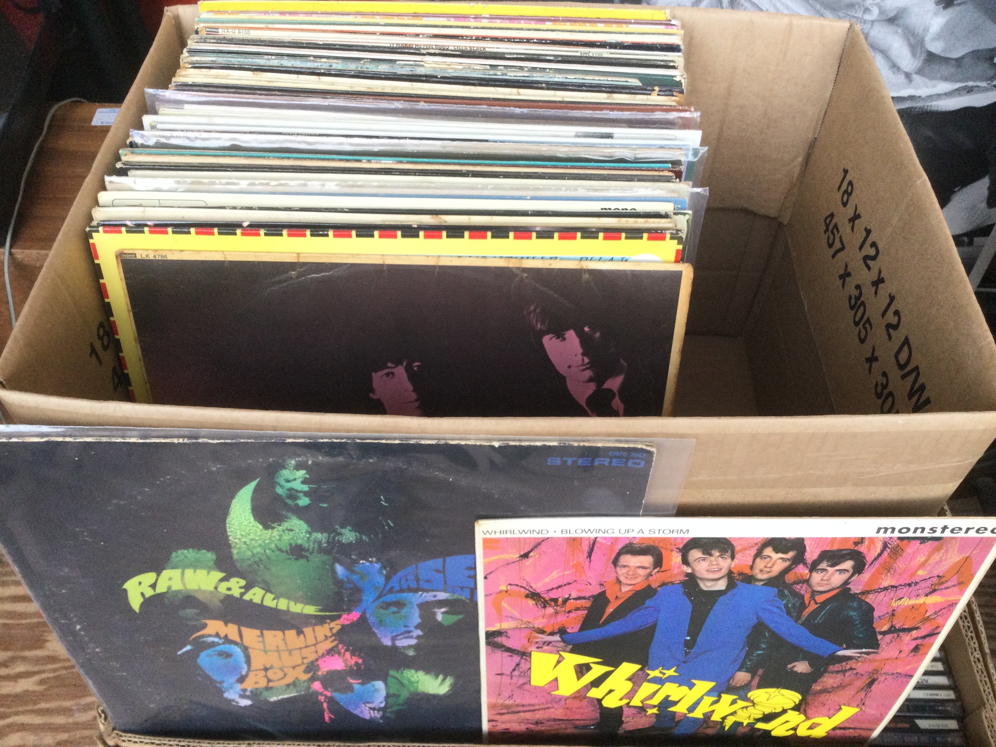A box of LPs and 12" singles by various artists including