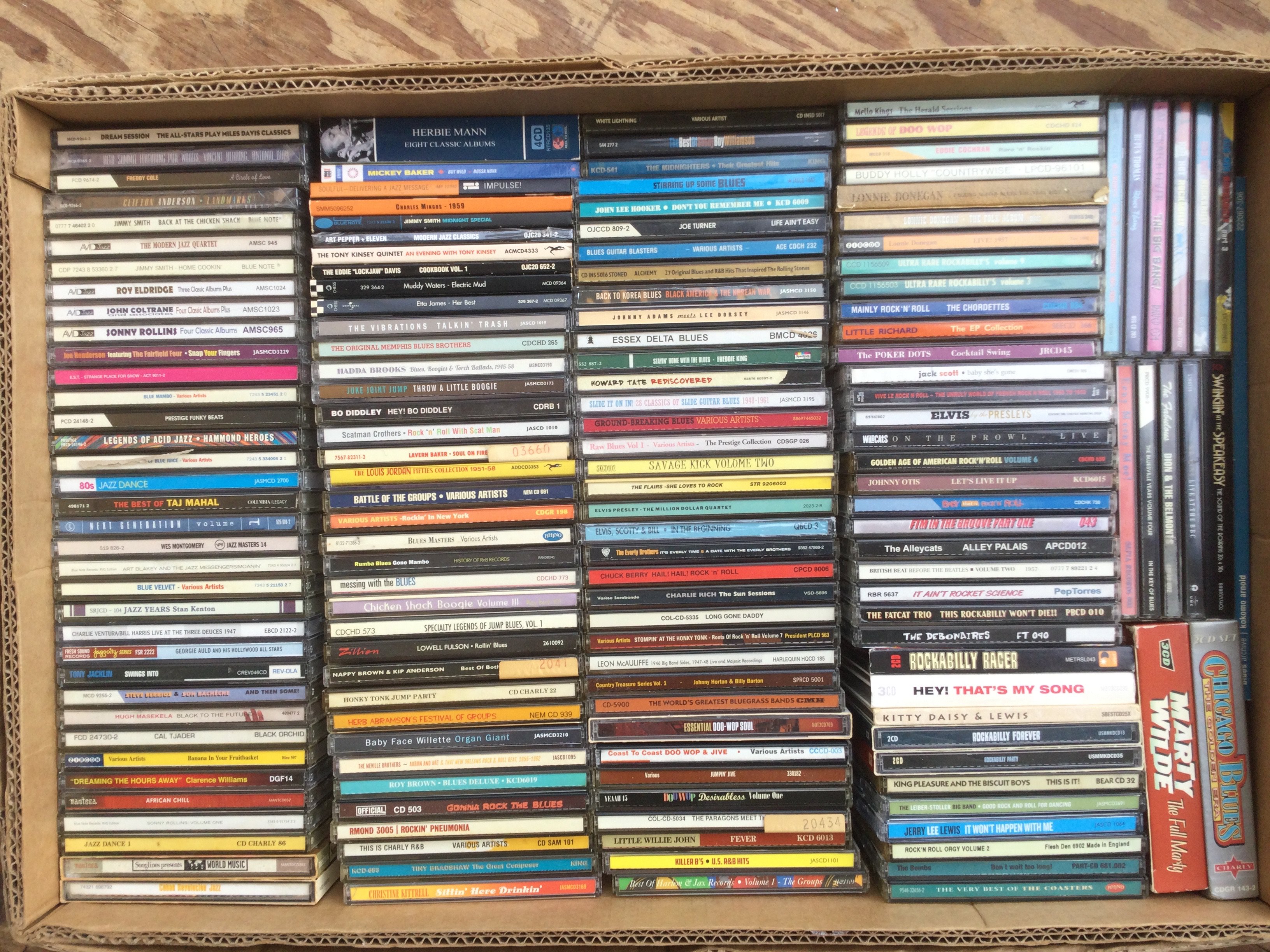 A box of jazz, blues and rockabilly CDs.