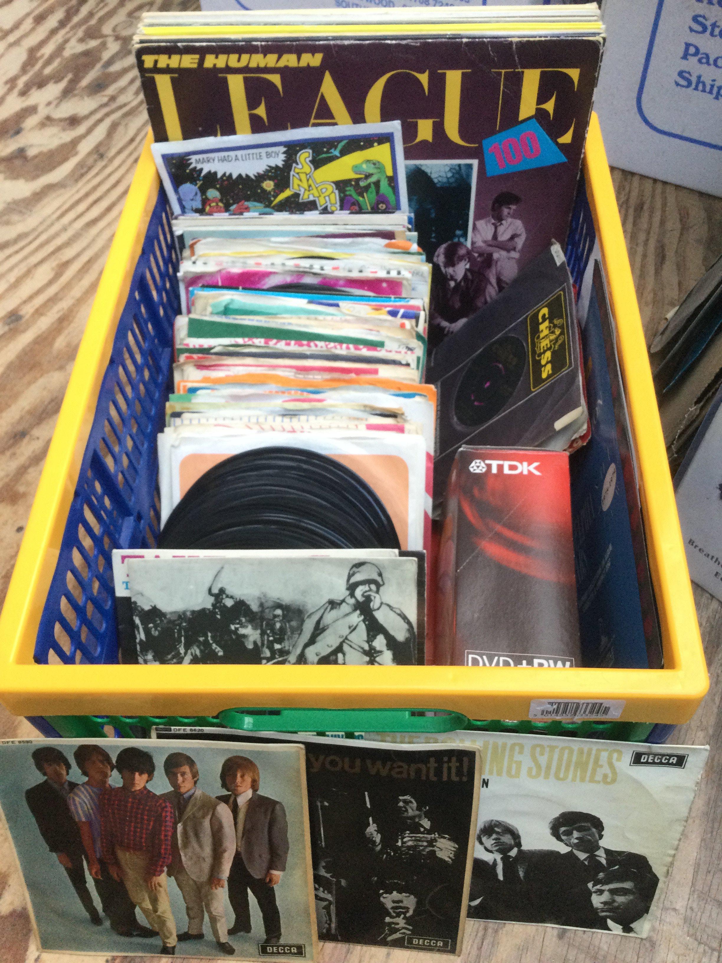 A box of 7" singles, EPs and LPs by various artists including The Rolling Stones, Traffic, Muddy Waters and others.