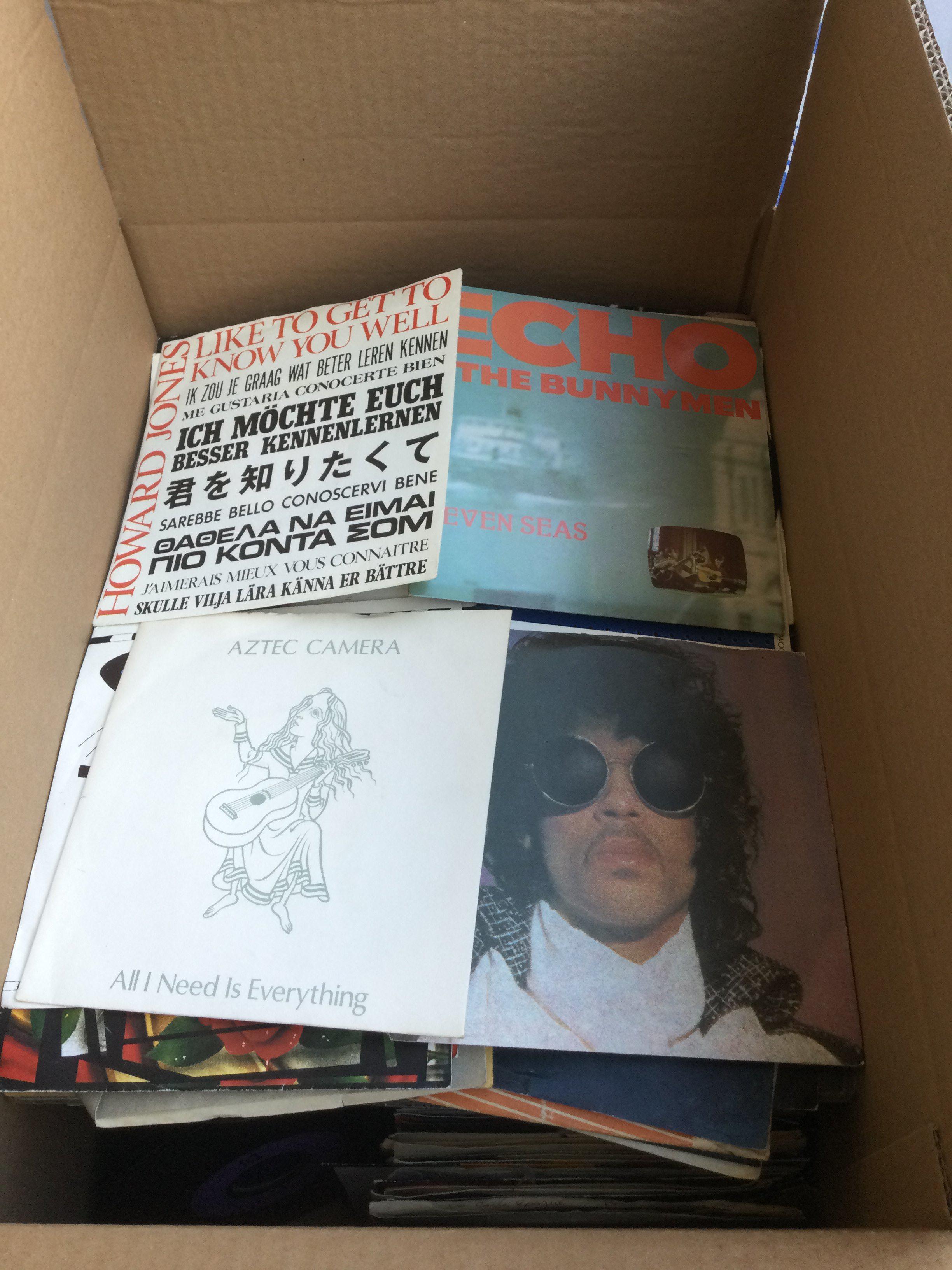 Two boxes of 7" singles by various artists from the 1960s onwards including Prince, Guns n Roses, Echo & The Bunnymen and many more.