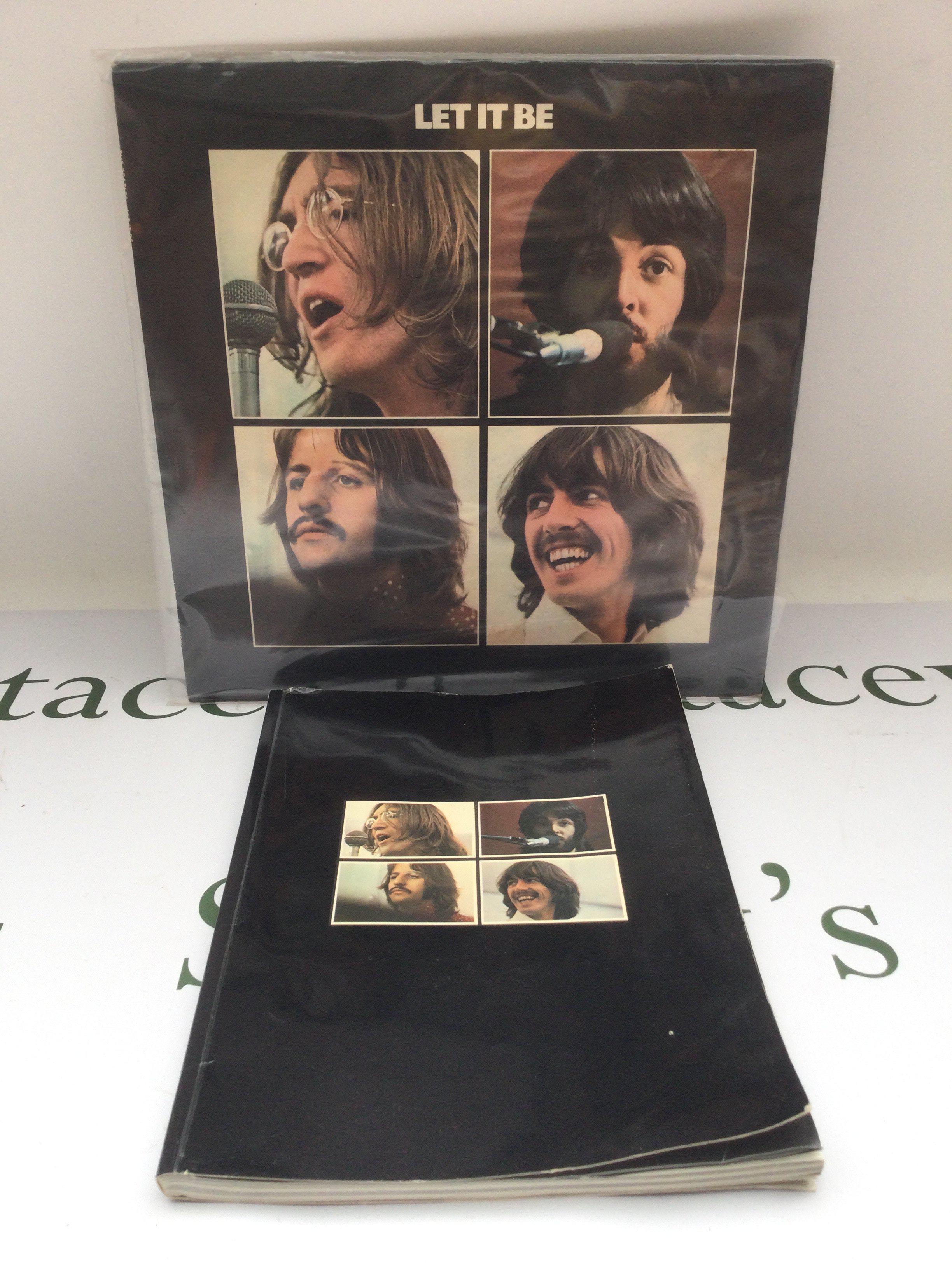 An early UK pressing of The Beatles 'Let It Be' LP together with the Get Back book that was initially part of the Let It Be first pressing box set.