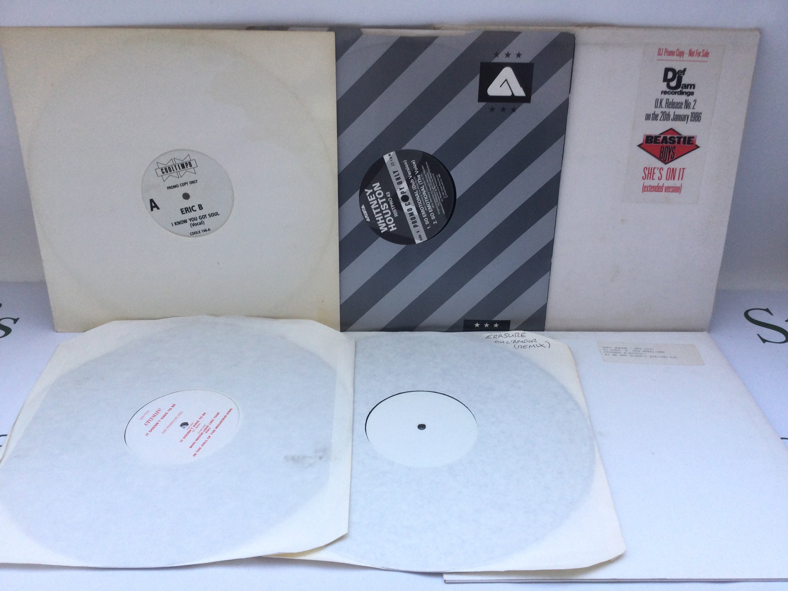 Six white label 12" promo discs by various artists including The Beastie Boys, Erasure, Gary Numan, Eric B and Whitney Houston.
