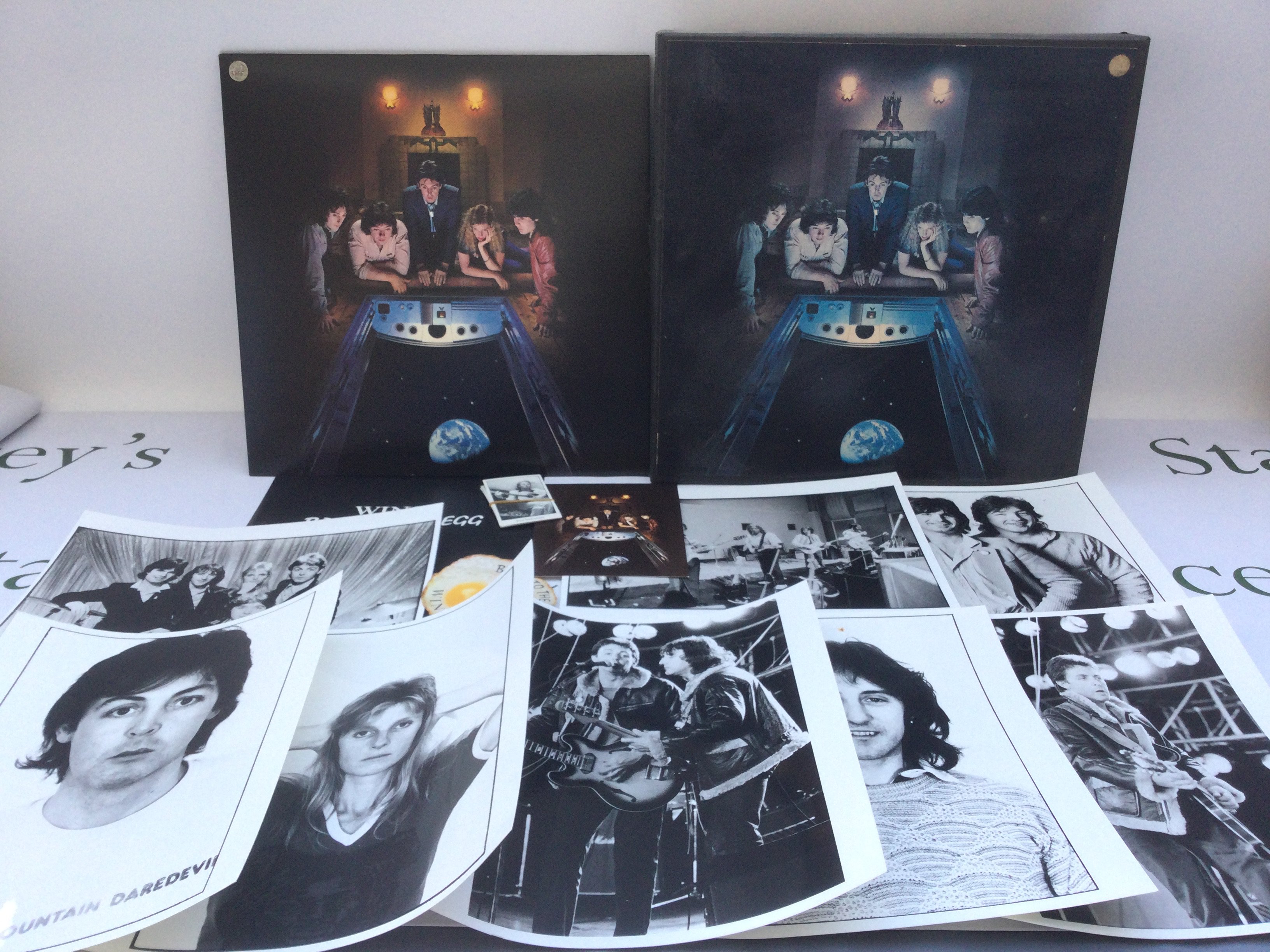 A Wings 'Back To The Egg' promotional pack containing the LP, 8 publicity photos with captions affixed to the reverse, five tea cards, sticker and postcard.