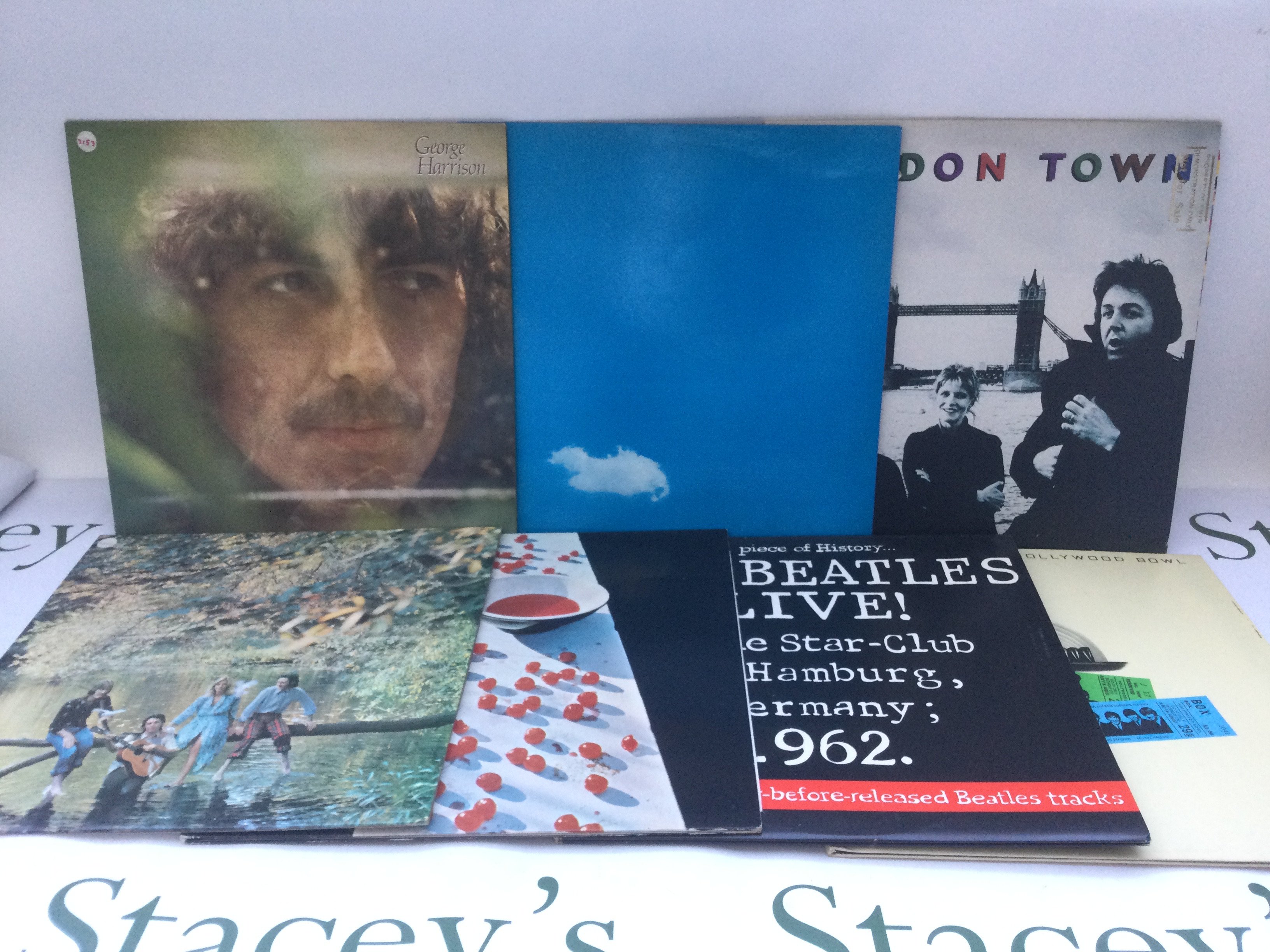 Fifteen Beatles and related LPs and 12" singles comprising a red vinyl '1962-1966', 'McCartney', a promo copy of 'London Town' and others.