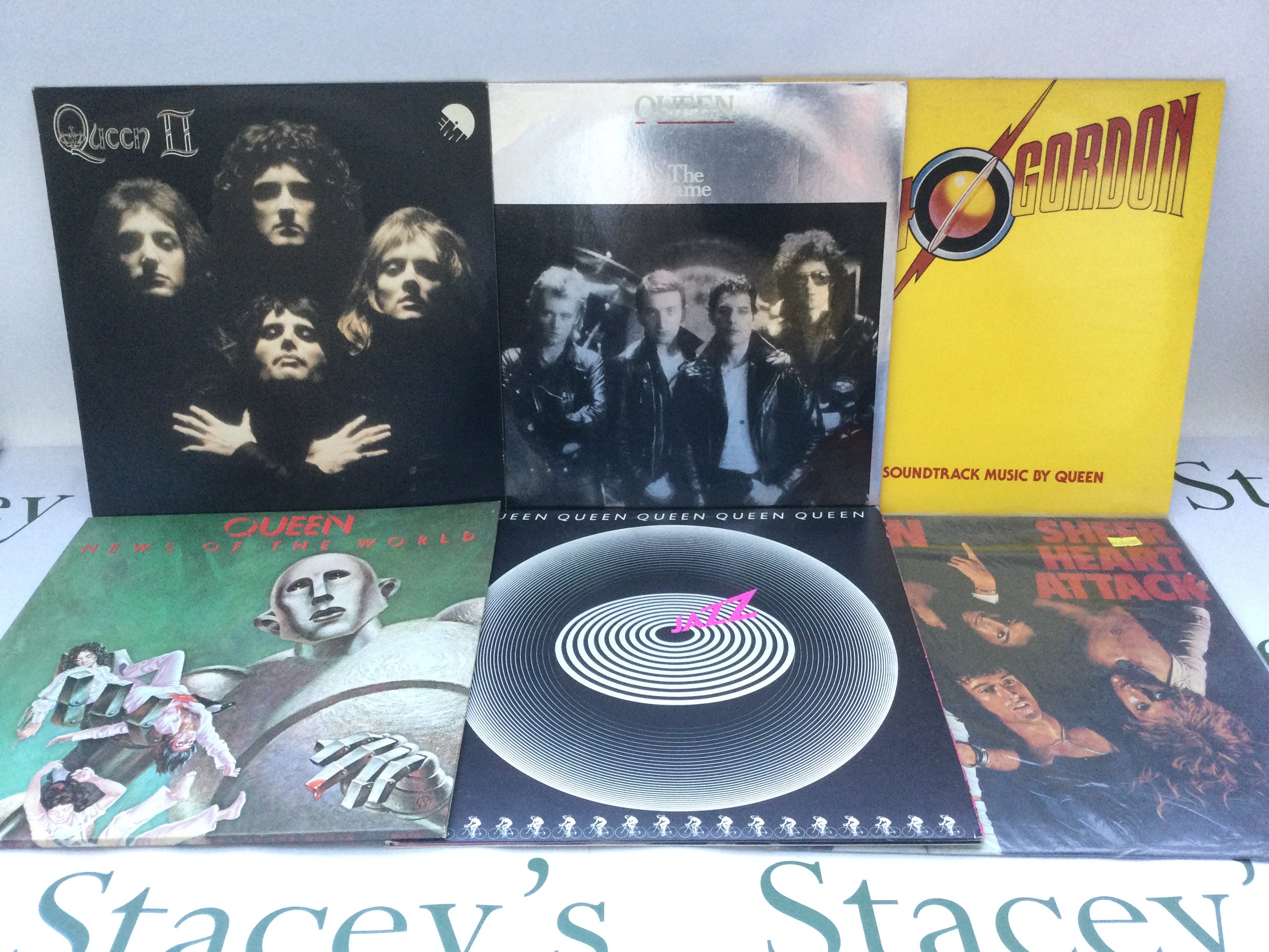 Six Queen LPs comprising 'Queen II', 'News Of The World' and others.