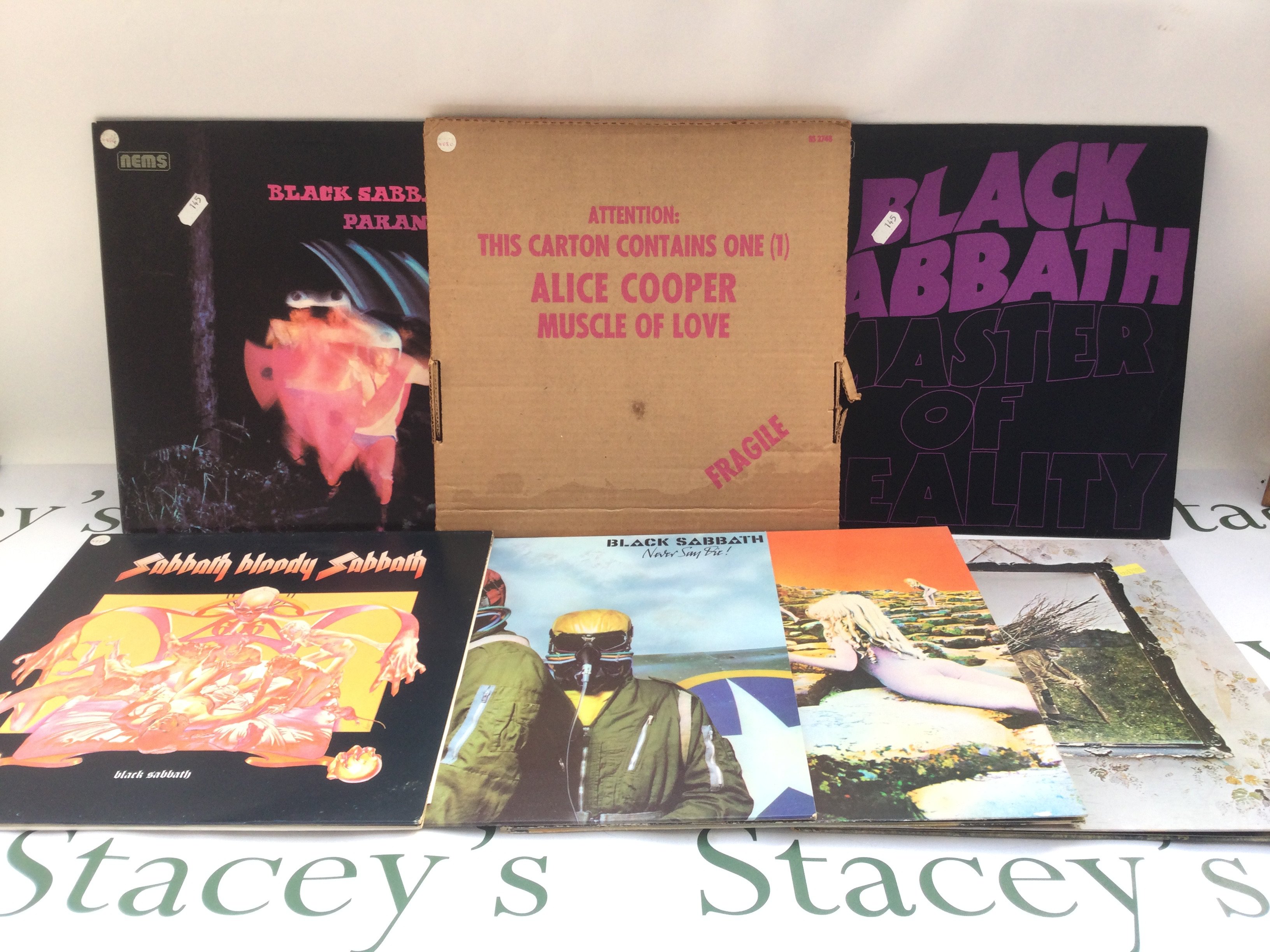 Seven hard rock LPs by Led Zeppelin, Black Sabbath and Alice Cooper.