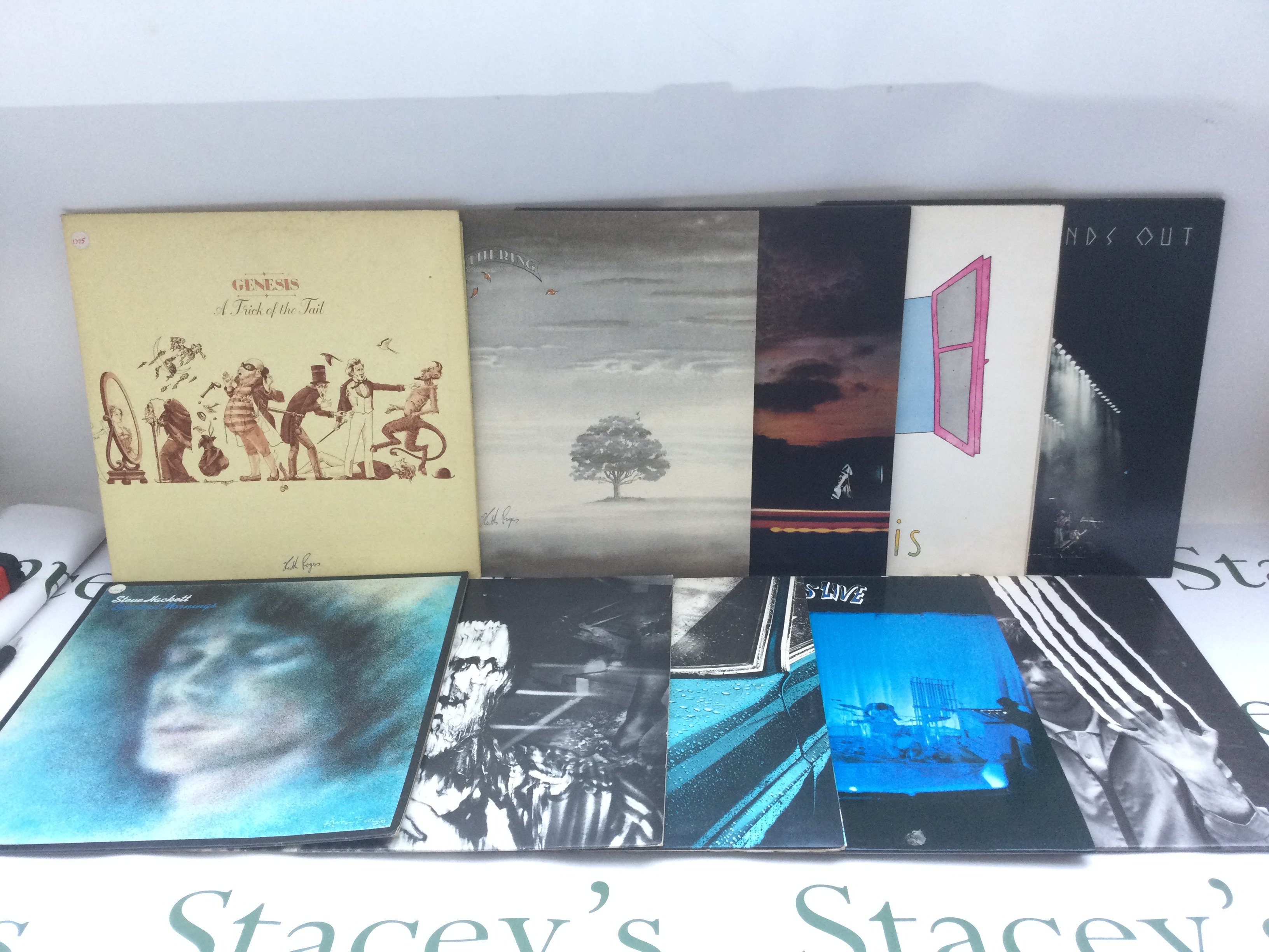 Ten Genesis and related LPs comprising 'A Trick Of The Tail', 'Spectral Mornings', 'Duke' and others. Includes a promo copy of 'Peter Gabriel'.