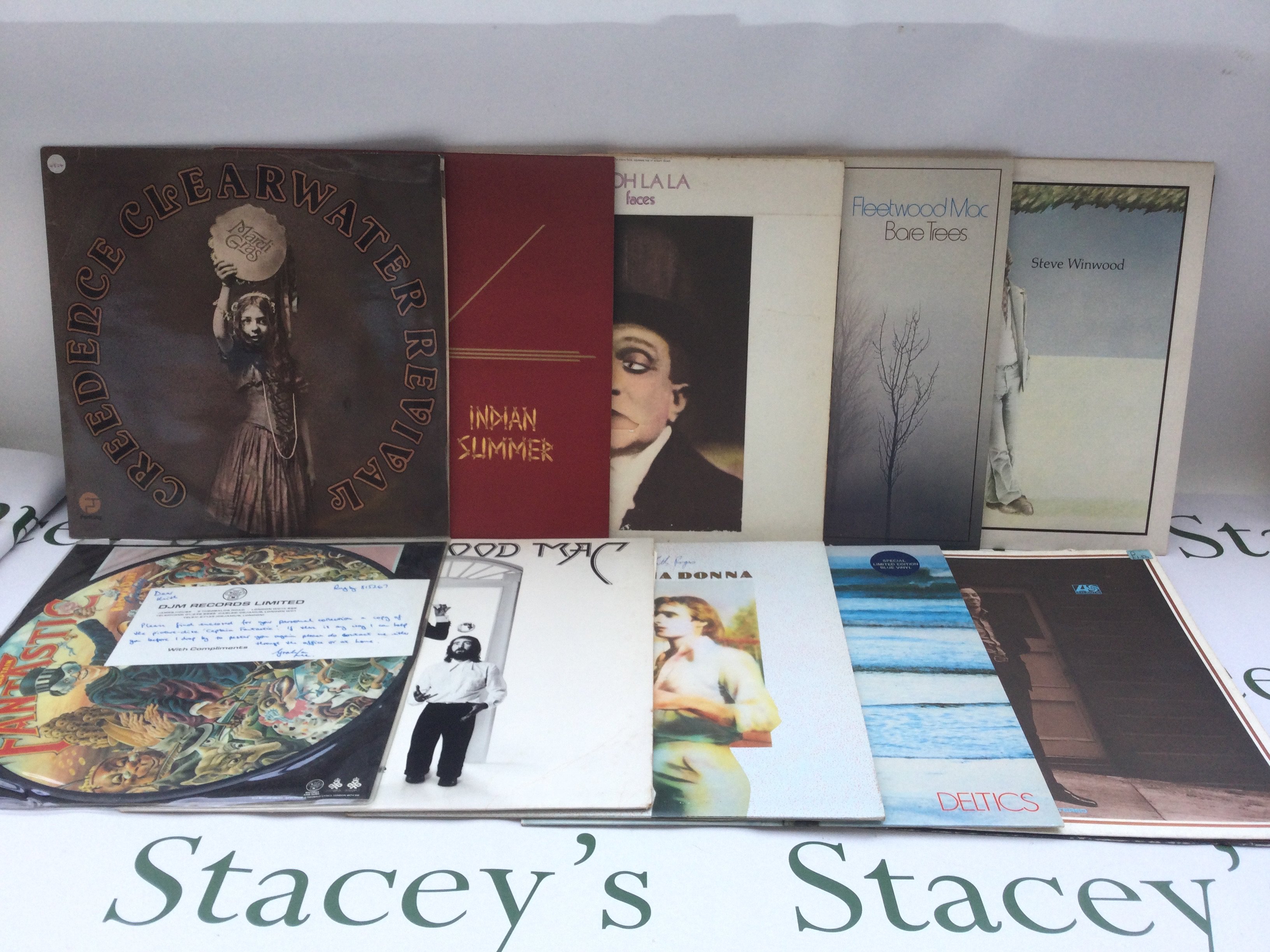 Two bags containing 21 rock and pop LPs by various artists including Fleetwood Mac, Elton John, Slade and others.