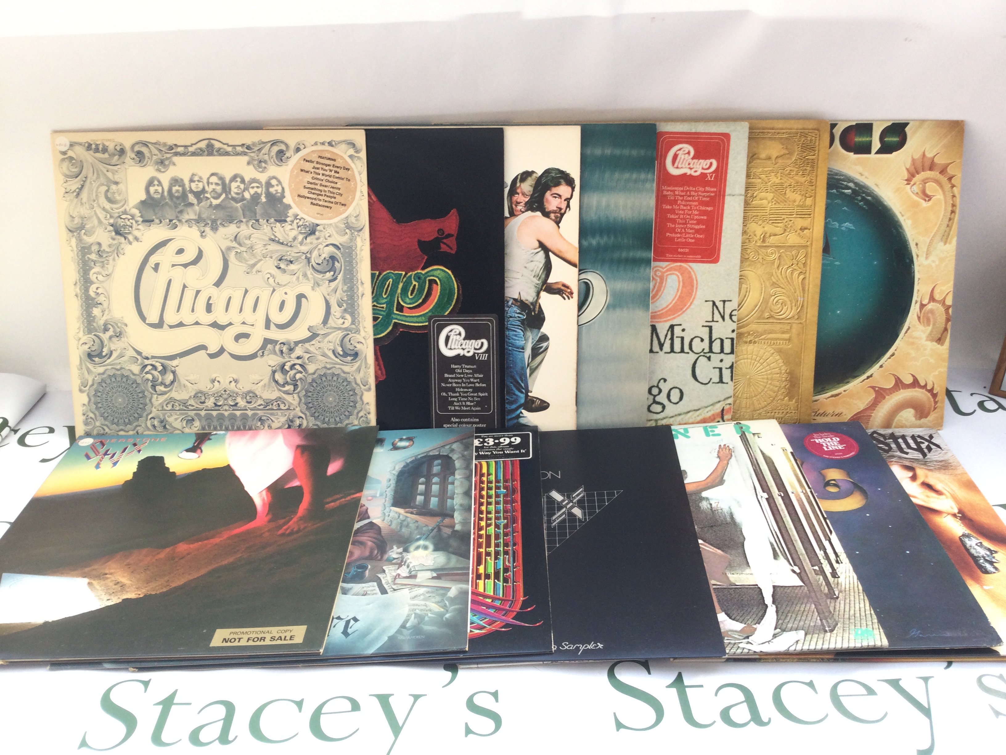 Fourteen soft rock LPs by various artists including Chicago, Styx, Foreigner, Journey and Kansas. Includes three promo copies and Styx radio sampler.