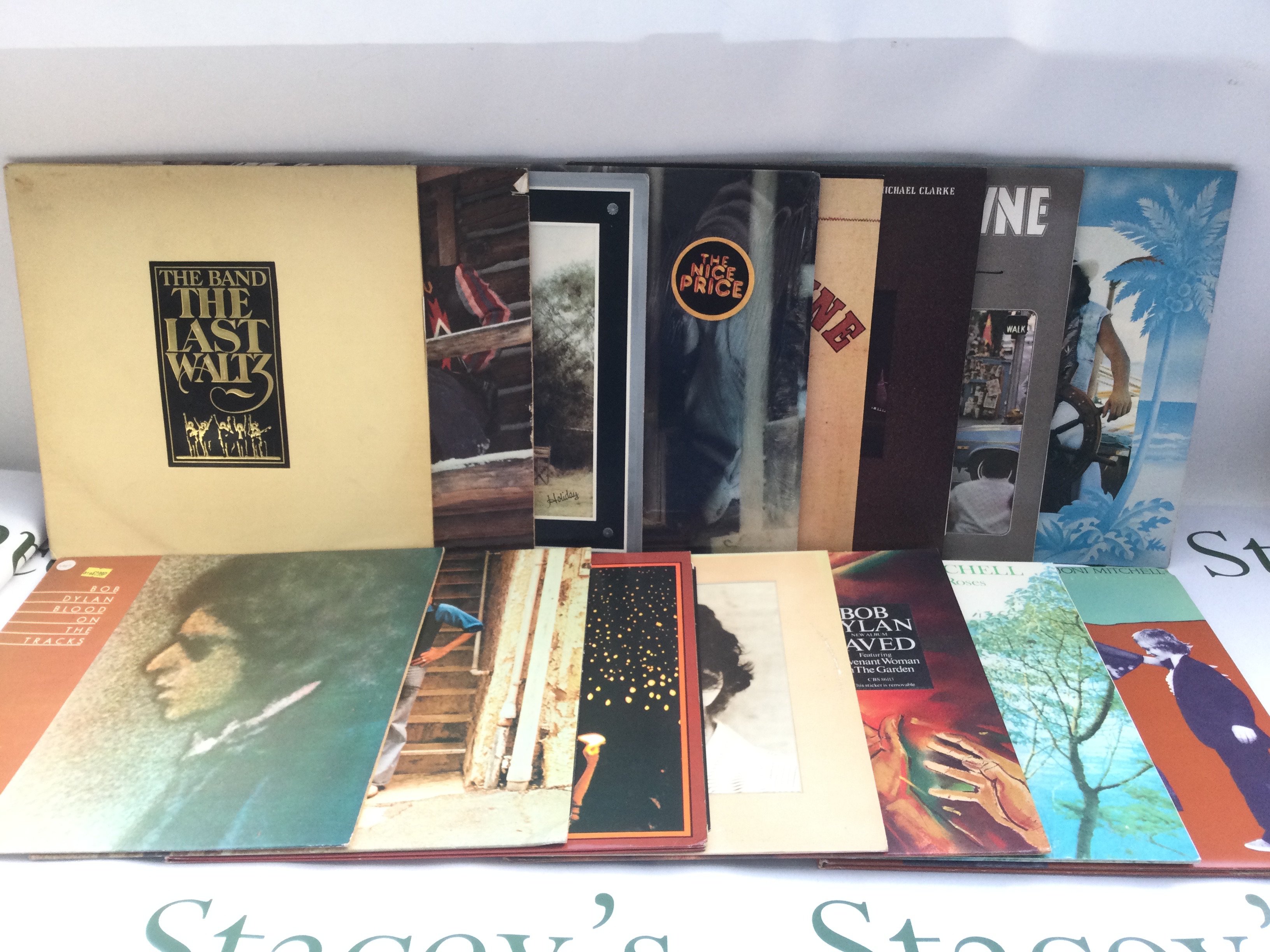 Fifteen folk rock LPs by various artists including Bob Dylan, Joni Mitchell, The Band and others. Includes two Bob Dylan promo LPs.