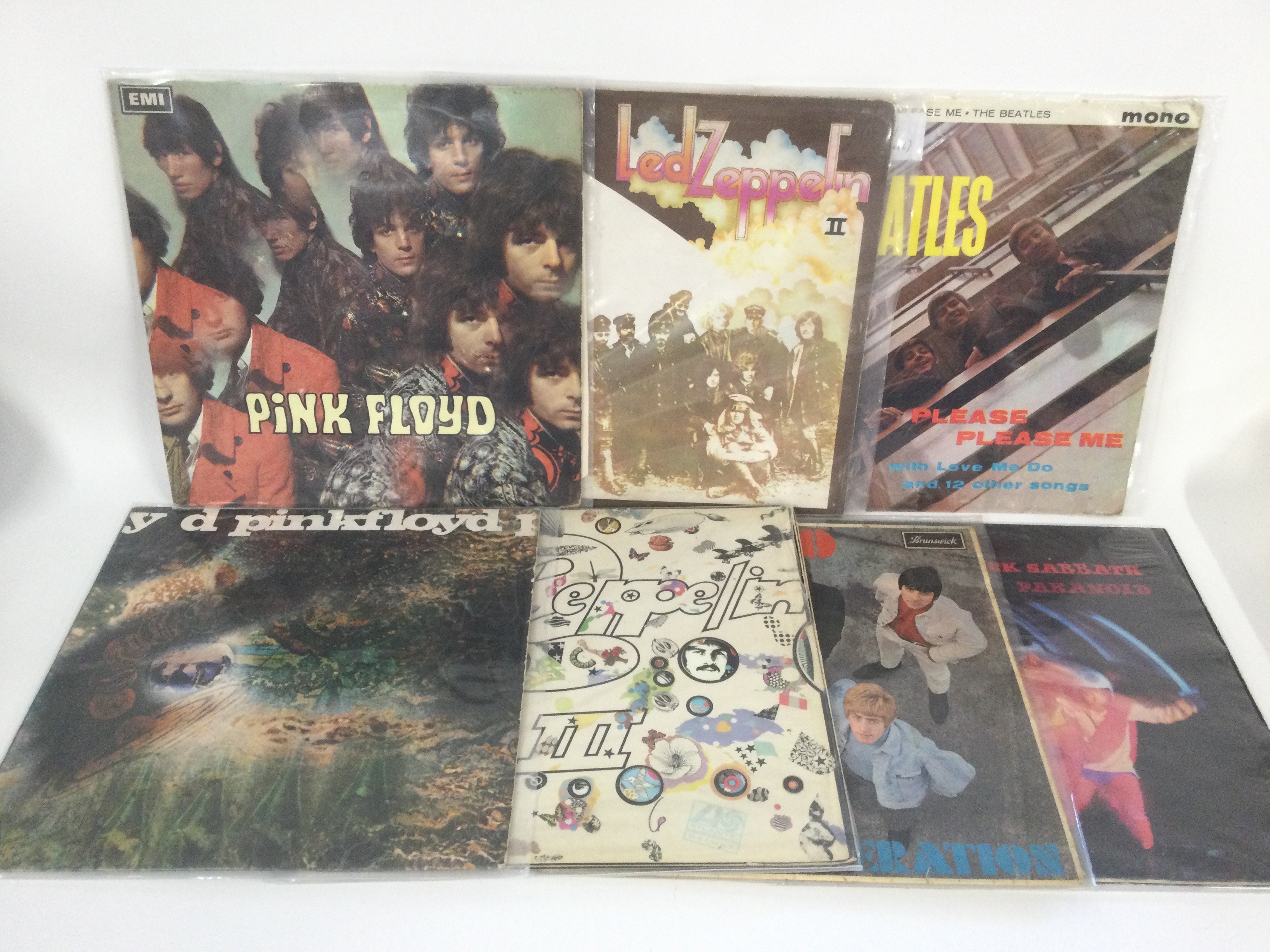 A fantastic instant collection of rarities in two large boxes of LPs, approx 200+, including a black and gold mono 'Please Please Me', red/plum Atlantic 'Led Zeppelin II' and 'III', early UK 'Piper At The Gates Of Dawn' plus various other collectable titles by The Who, Gentle Giant, Black Sabbath, Queen and many more.