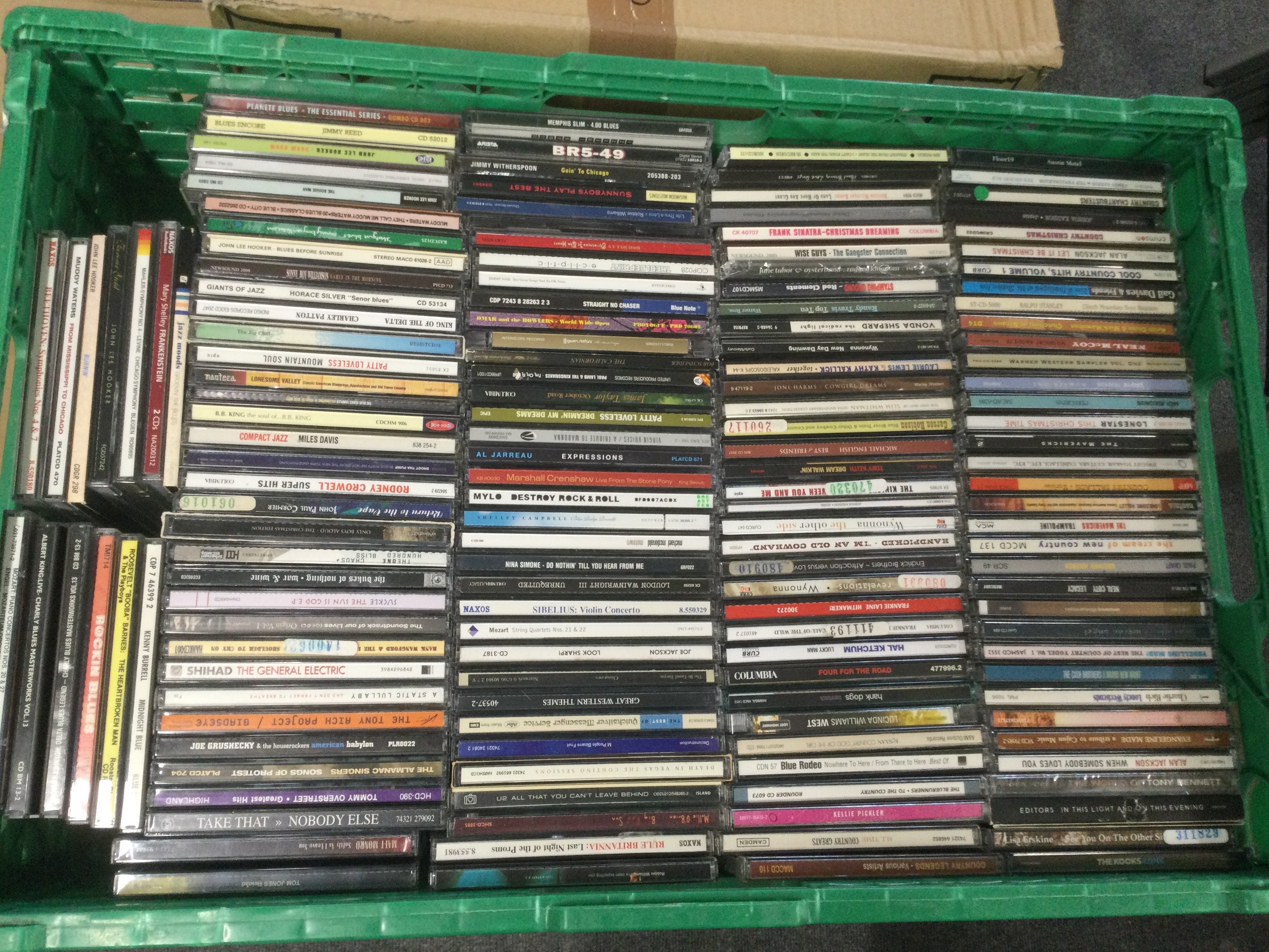 Eight boxes of CDs by various artists. Includes promotional discs.